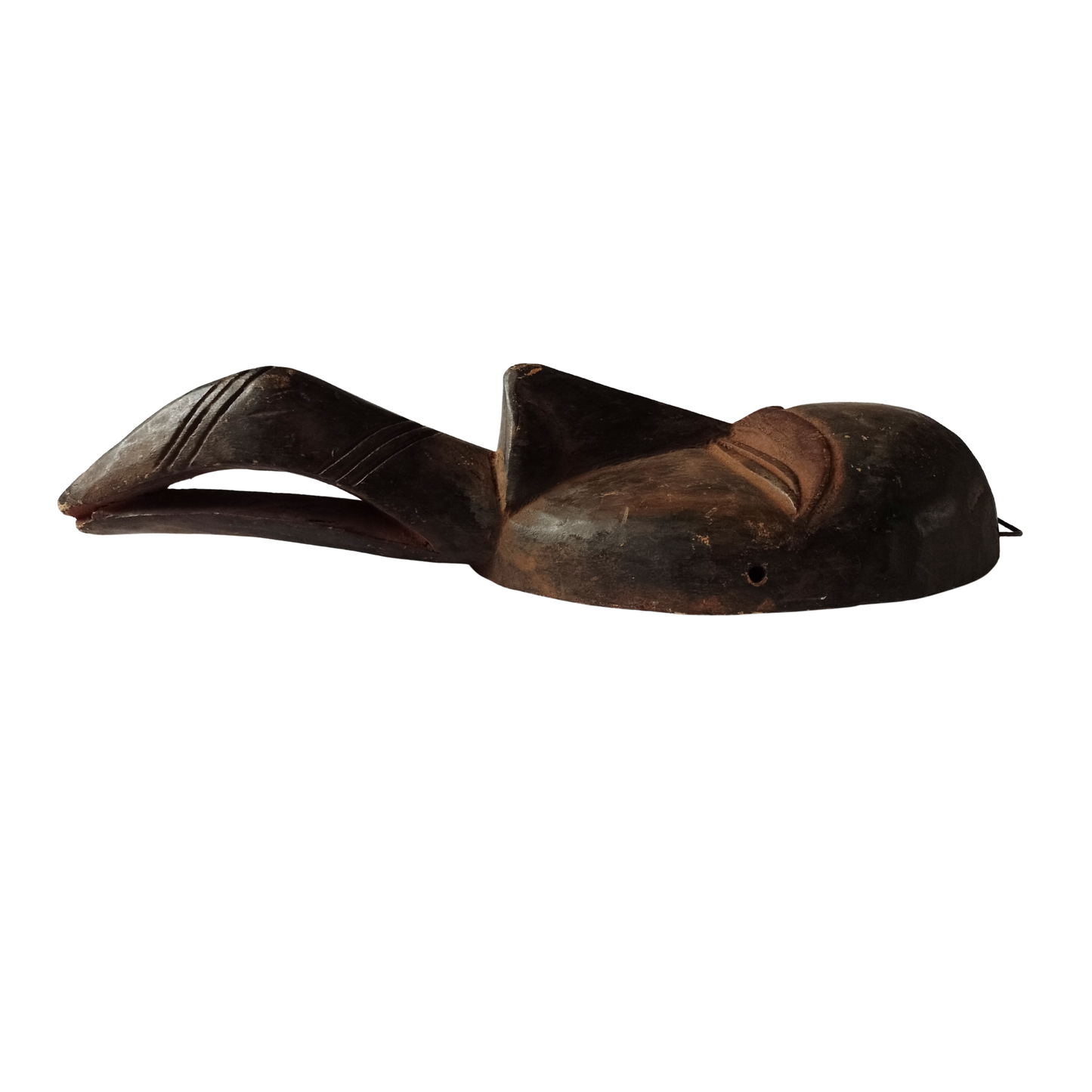 A wooden tribal mask on a white background