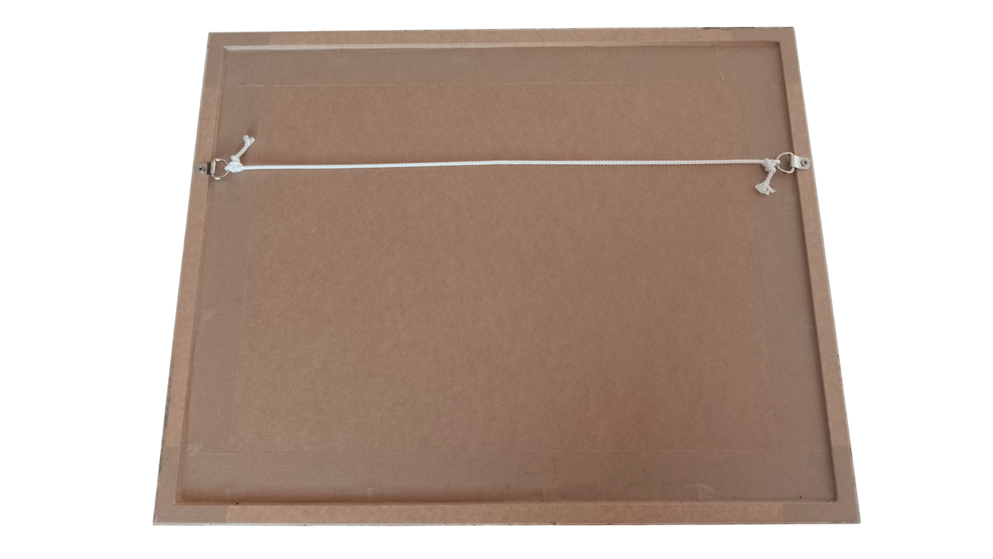 The reverse of a wooden picture frame with white string for hanging.
