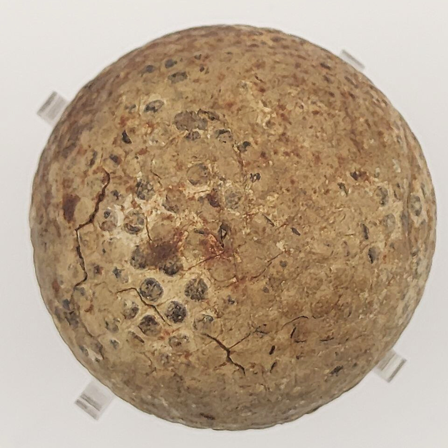 Old golf ball on a light background