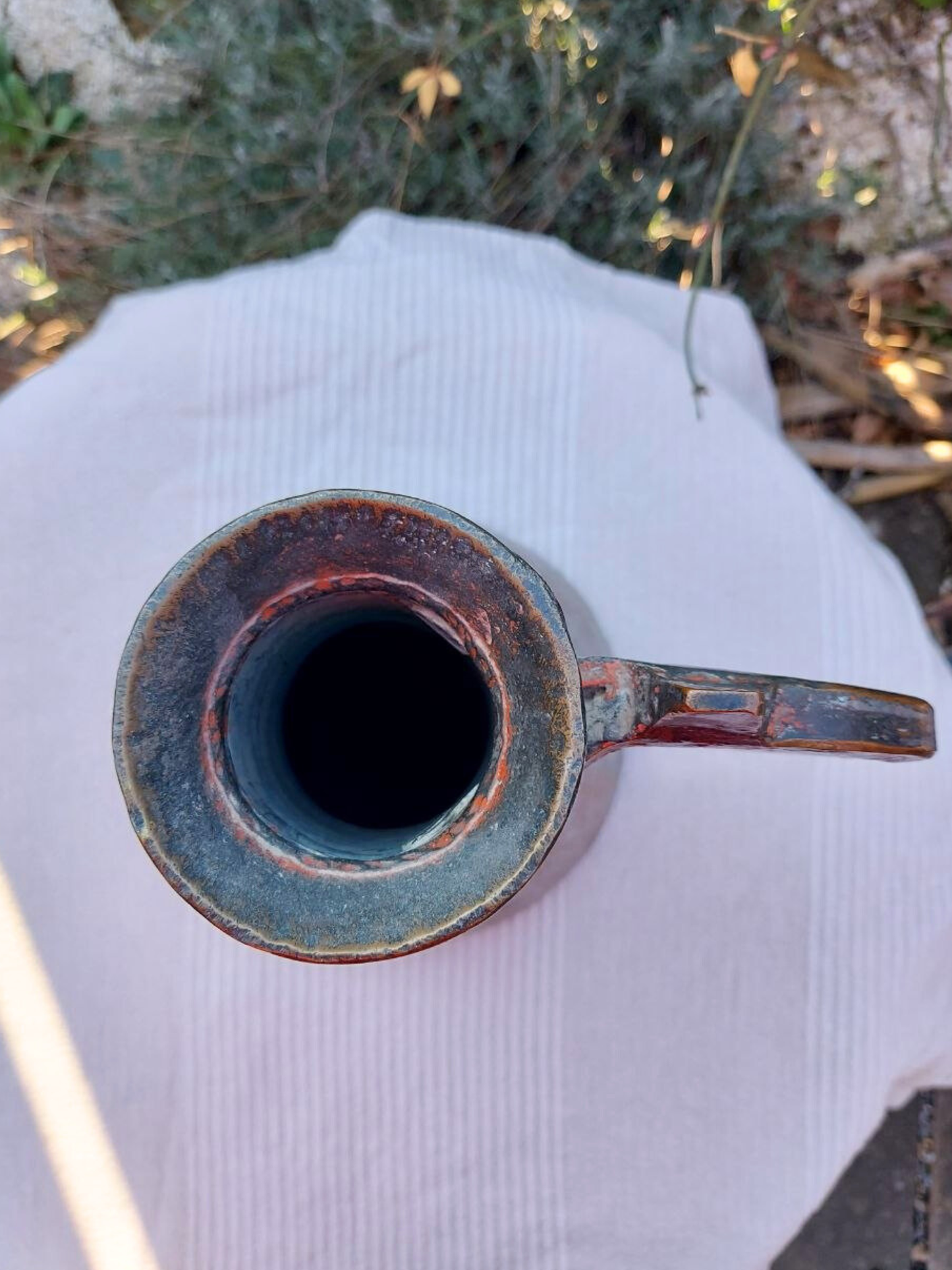 The top of a Turkish copper water jug from above