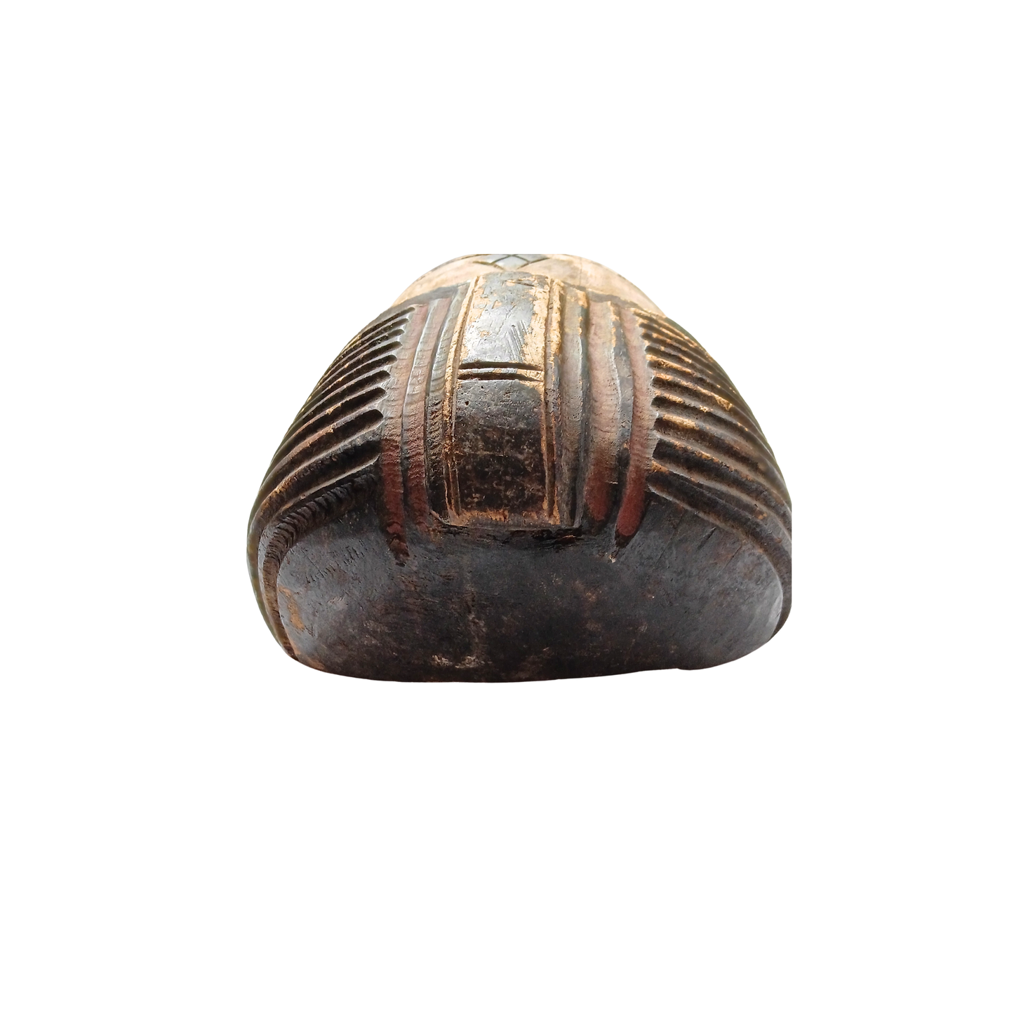 A carved wooden mask with a rounded, dome-like shape, featuring horizontal grooved lines and a central raised panel, shown against a plain white background.