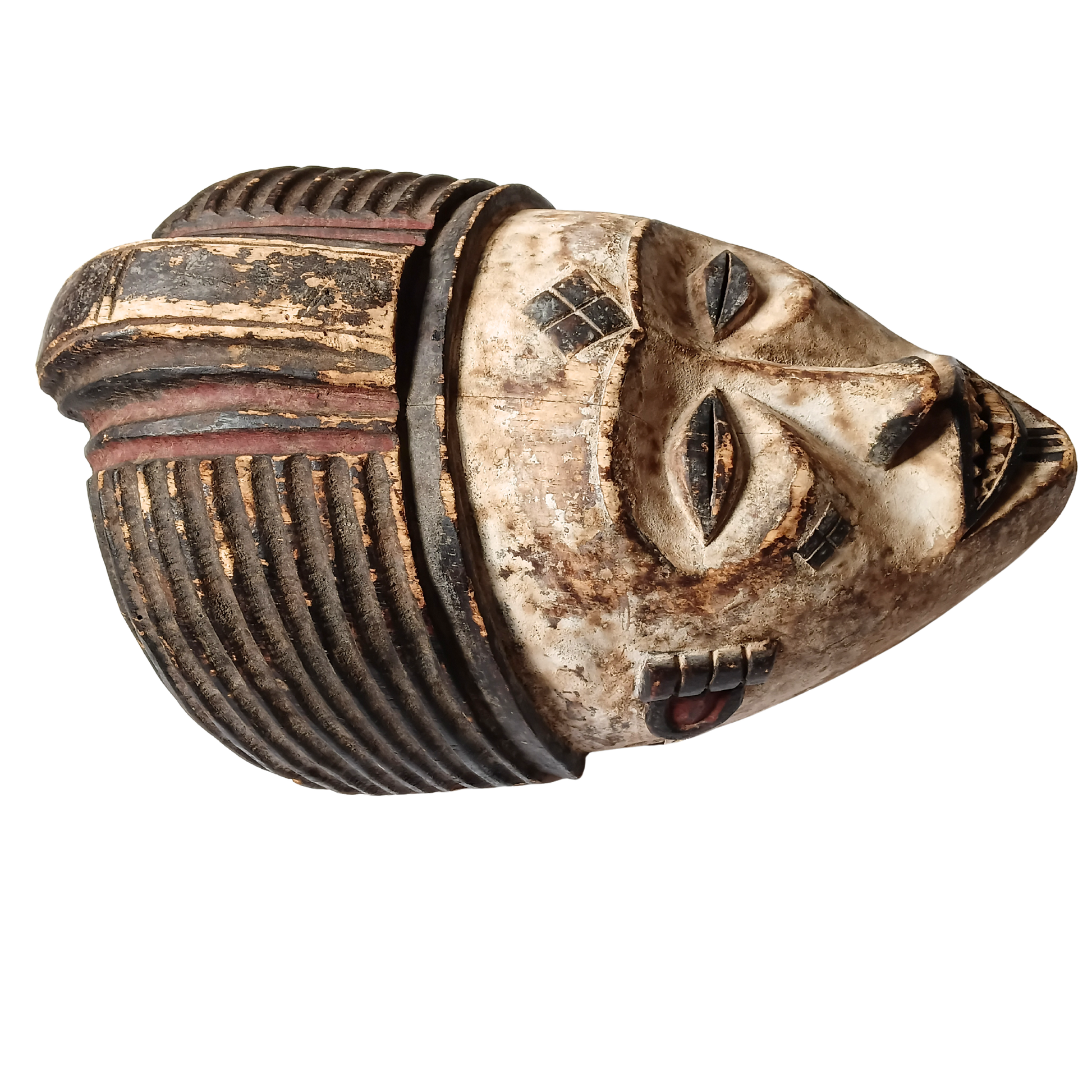 An African-style carved wooden mask with a weathered beige face, dark brown and black ribbed hair, and small red painted accents, shown on a plain white background.