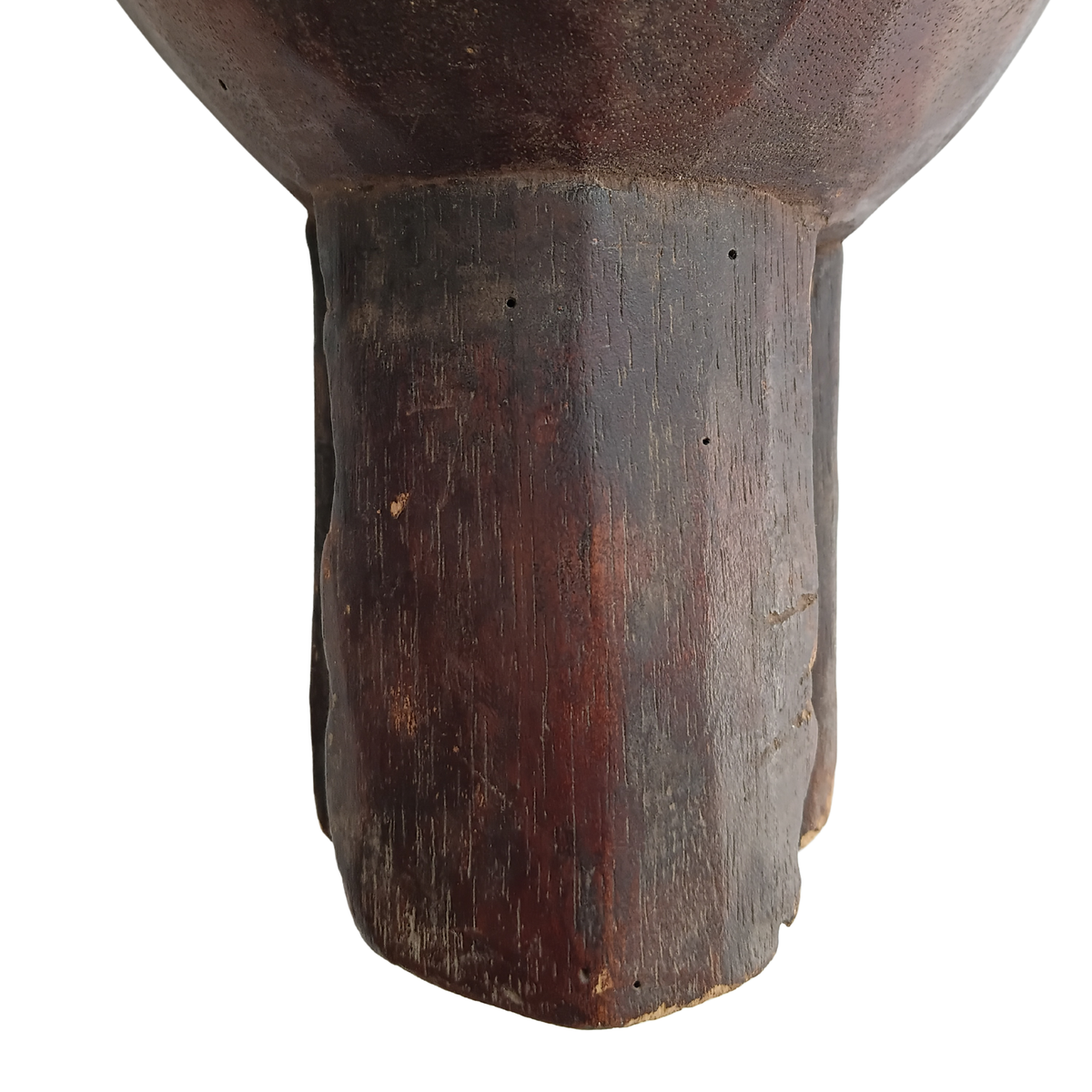 Close-up of the base of a dark brown wooden spoon handle on a white background.