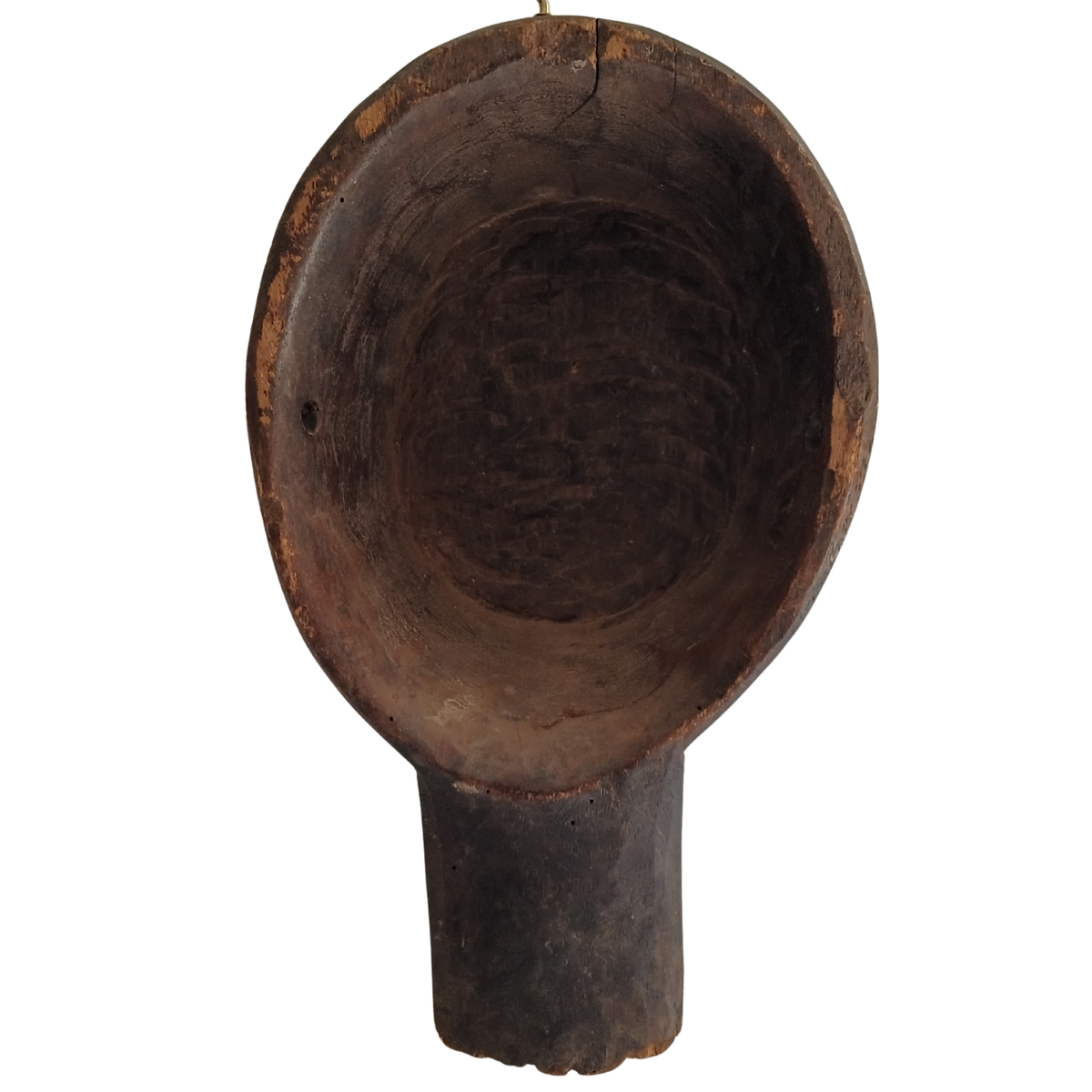A dark brown carved wooden spoon with a cylindrical stem, photographed against a solid white background.