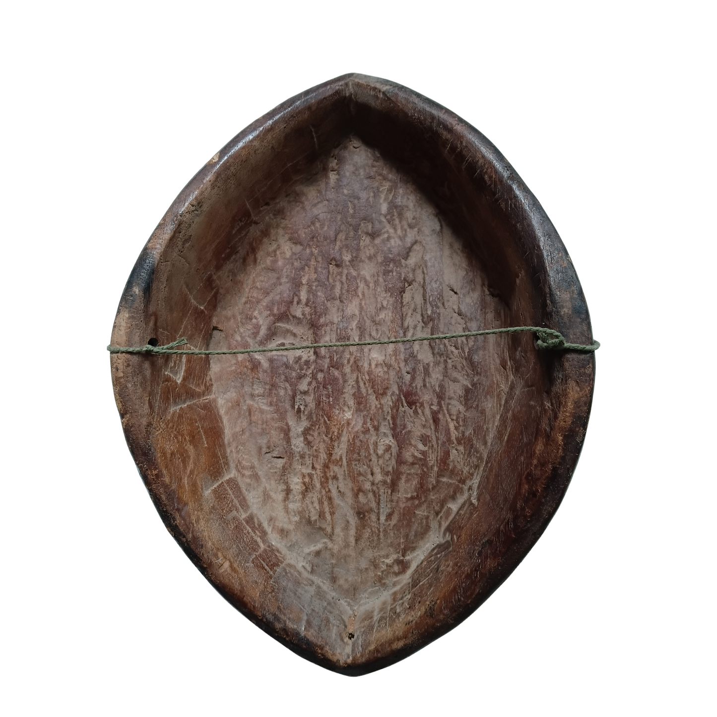 The reverse of an African wooden mask with hanging string. 