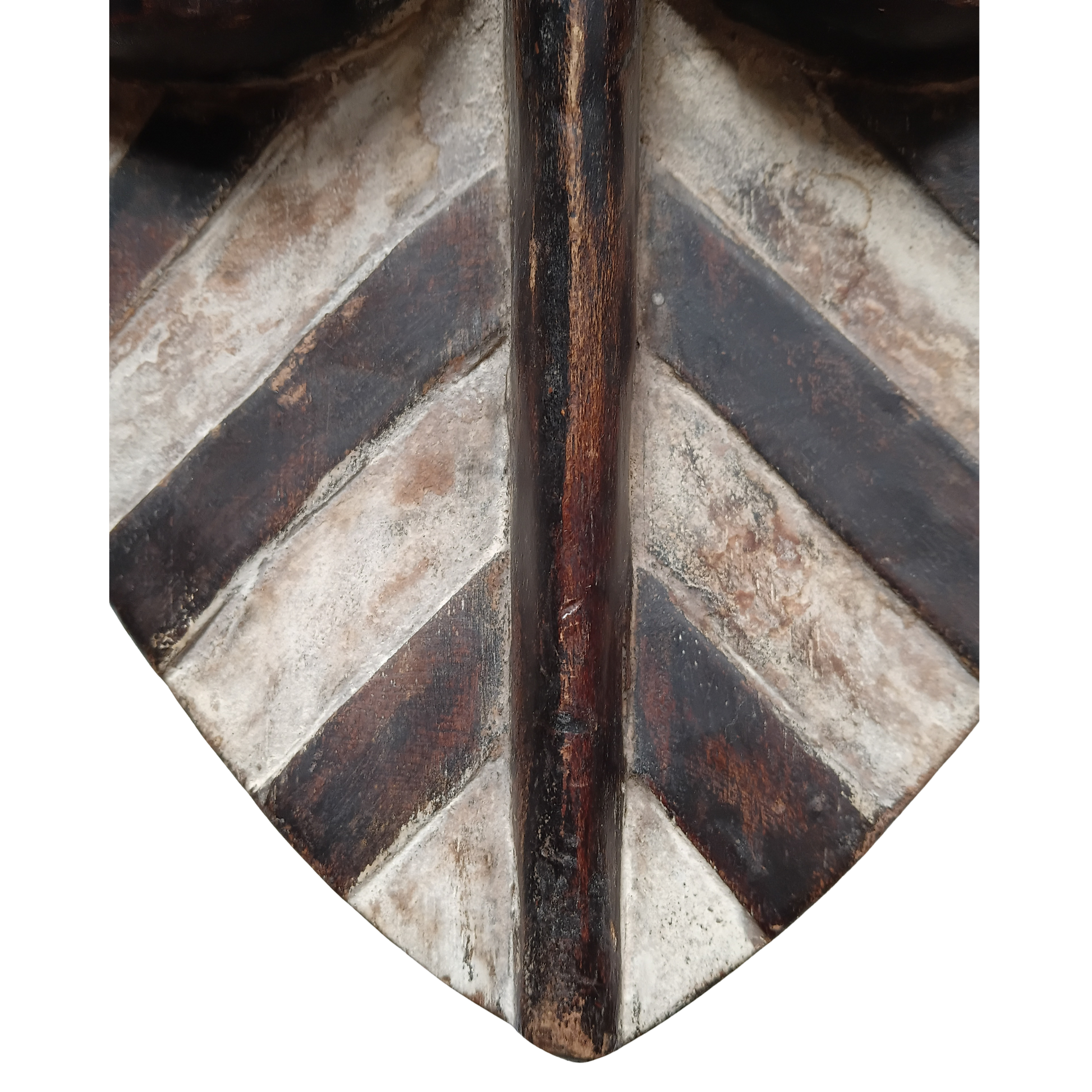 Close-up of a decorative wooden mask with a chevron pattern in dark brown and weathered off-white tones, centered on a white background.