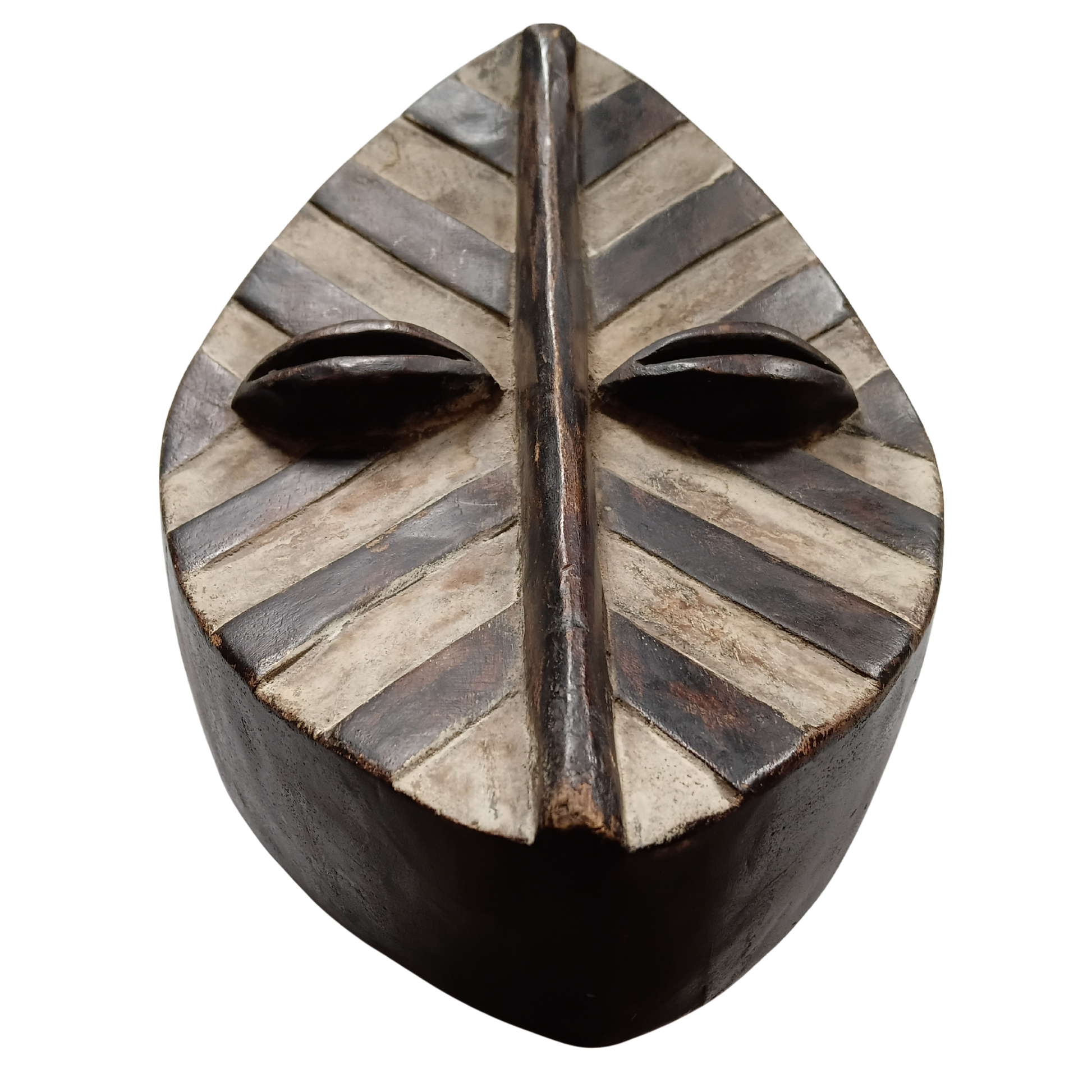 A carved wooden African-style mask or decorative sculpture with two prominent eyes and a vertical forehead slit, shown on a plain white background.