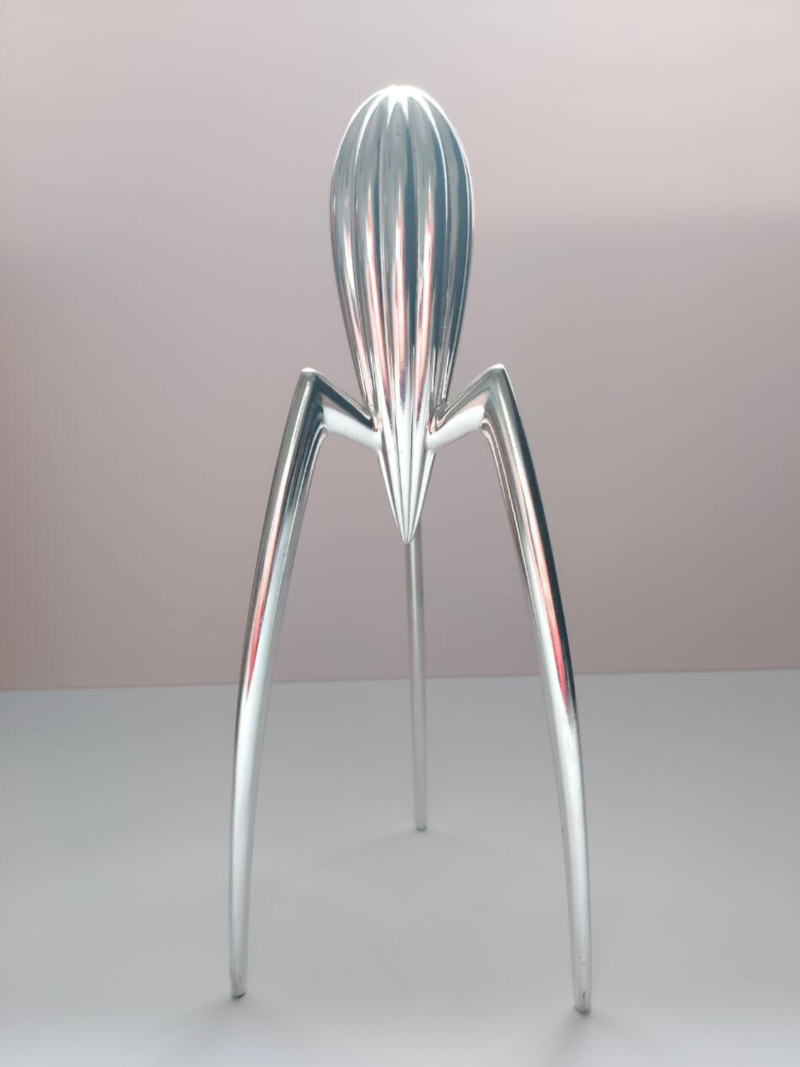 Philippe Starck lemon squeezer on a plain background