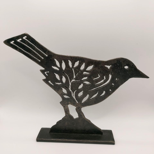 Steel bird sculpture on a white background