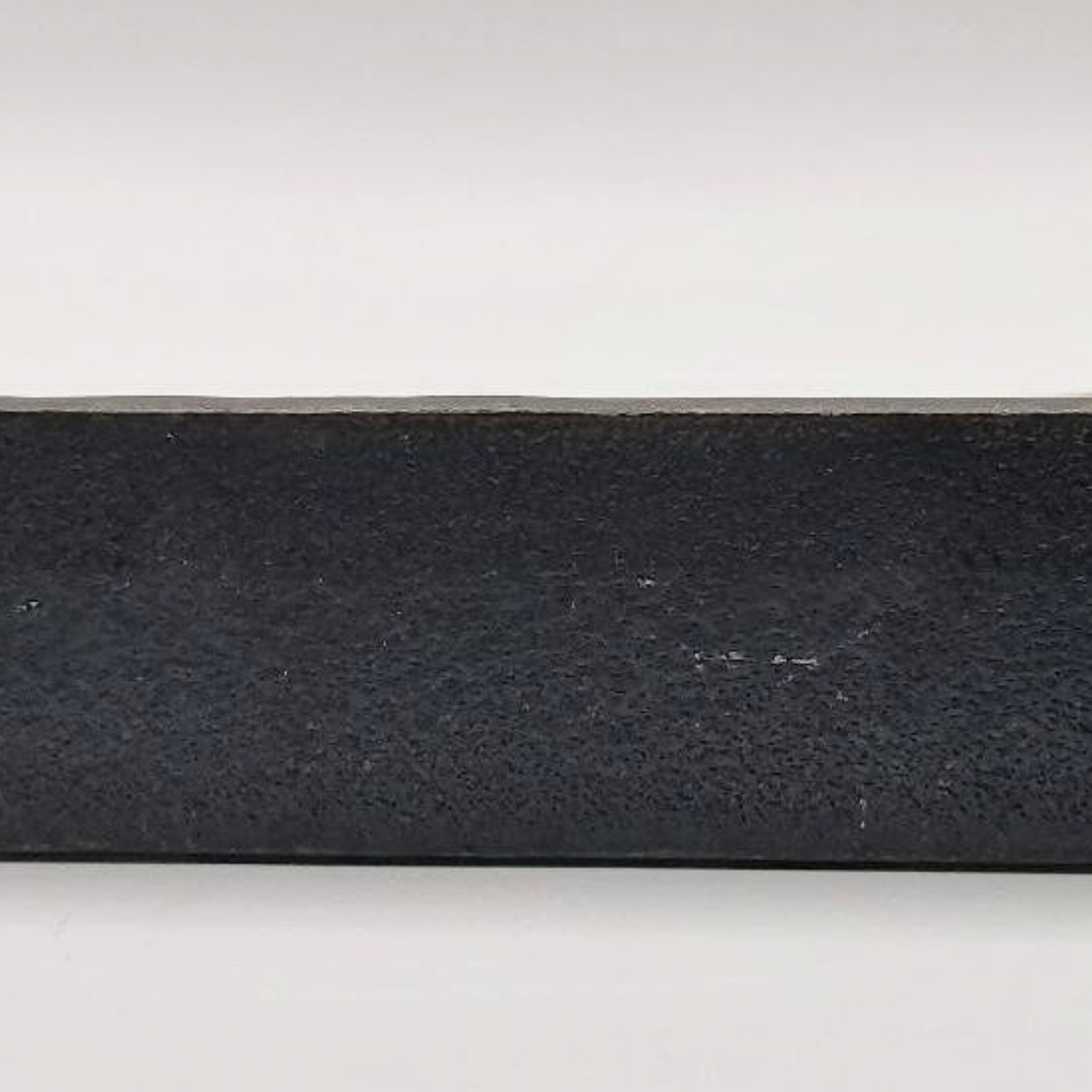 The base of a bird sculpture on a white background