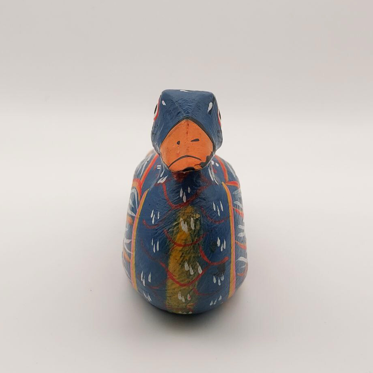 A face-on view of a blue duck napkin holder
