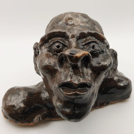 Ceramic bust against a white background