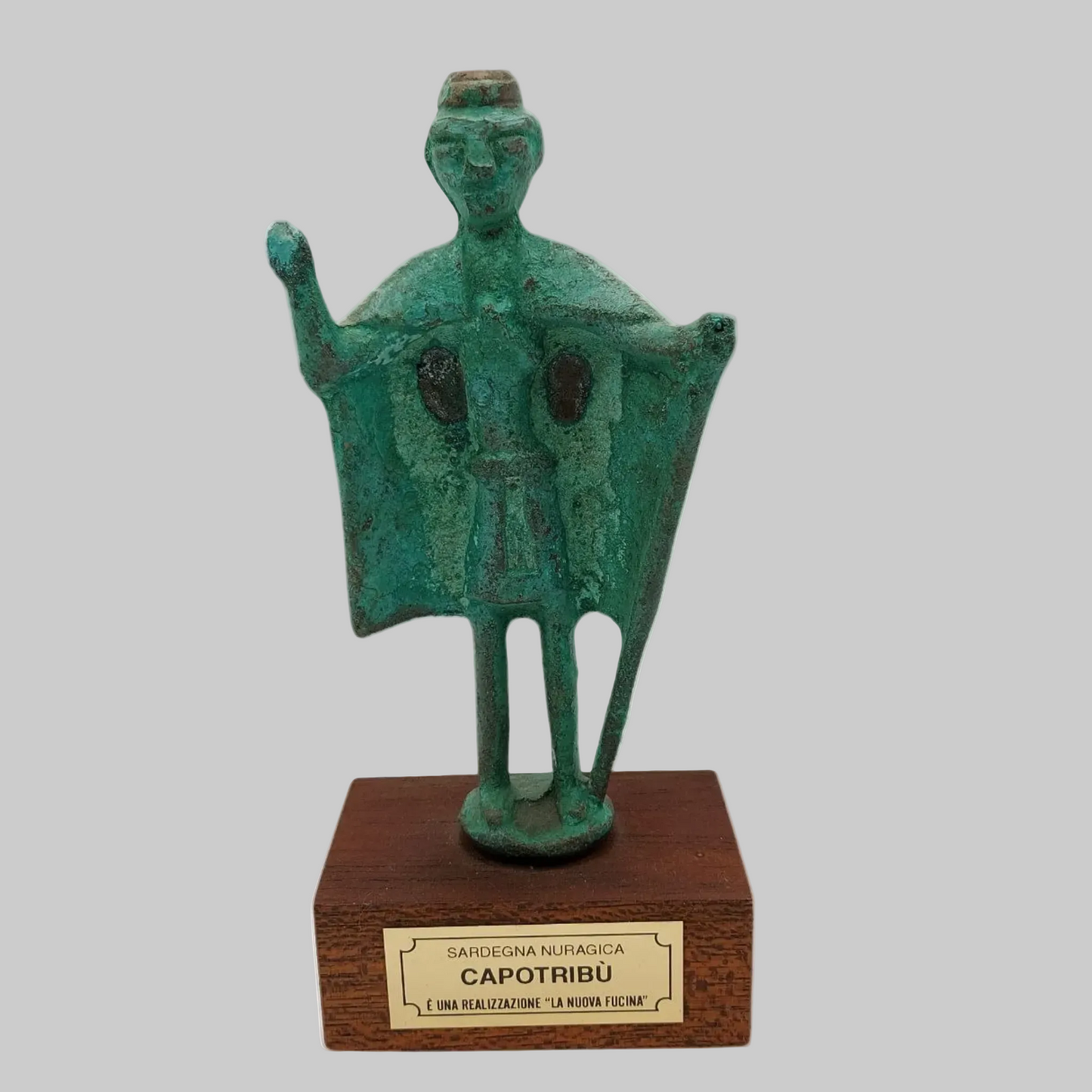Cast bronze statue on a white background