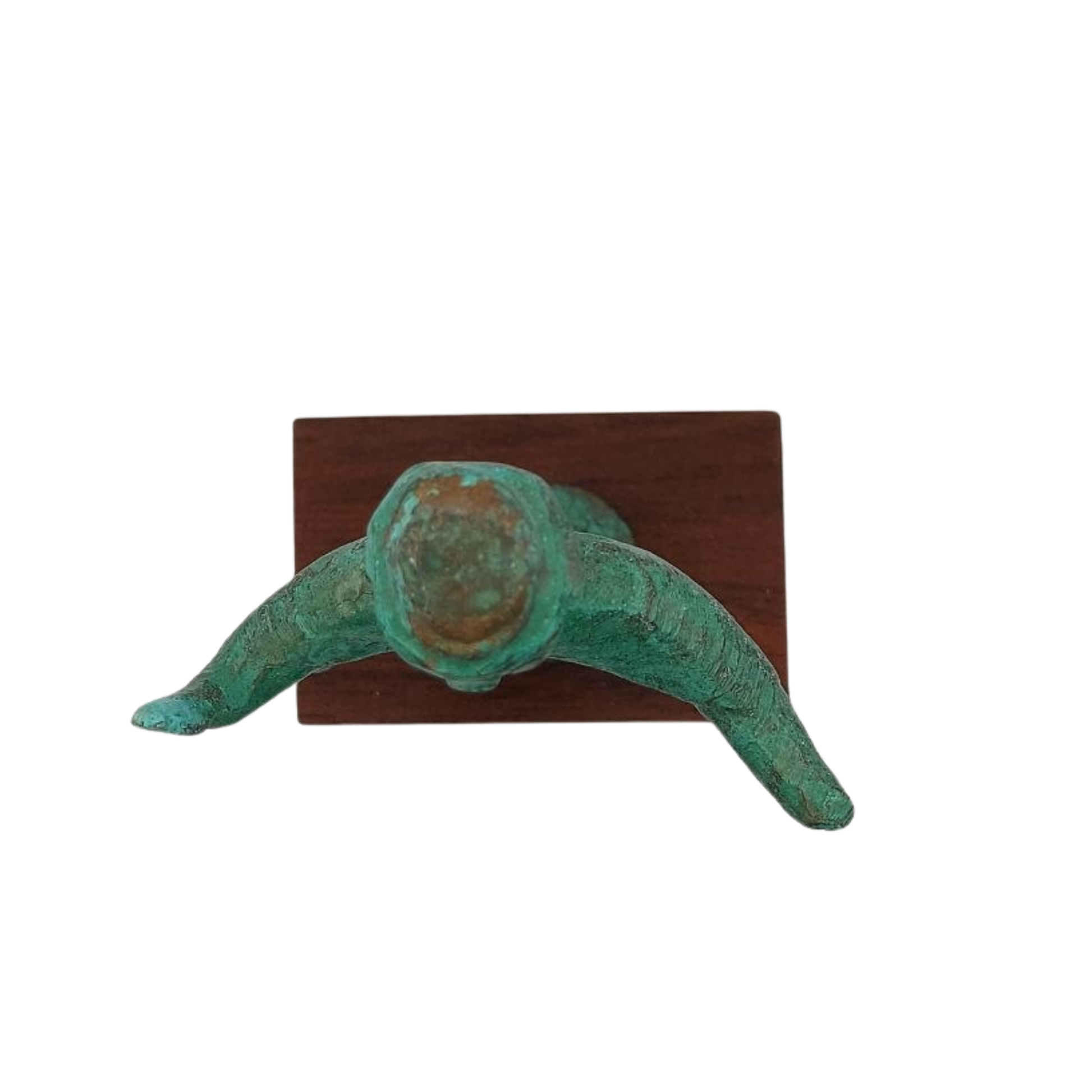 A top-down view of a cast bronze statue against a white background