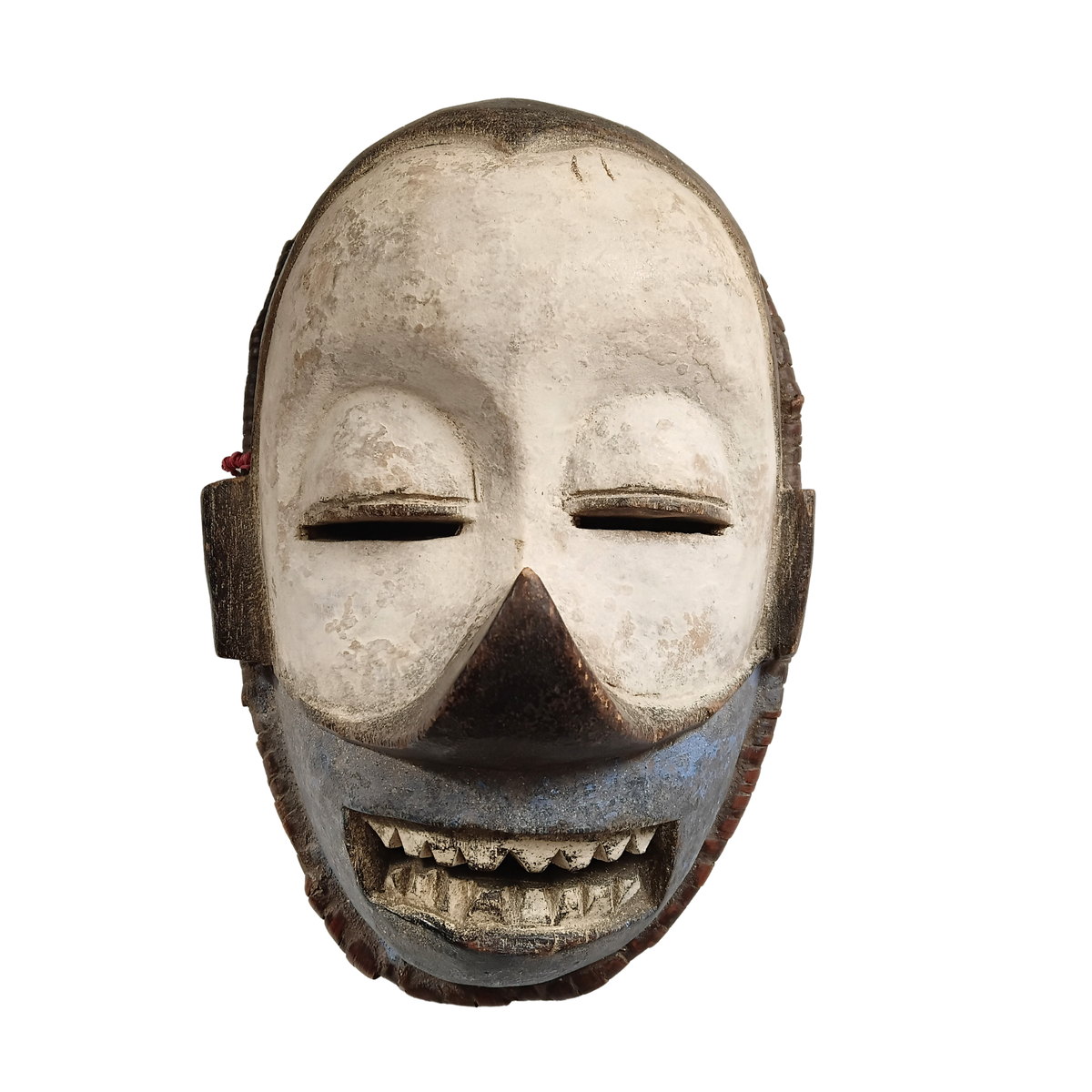 A carved wooden mask with a weathered off-white face, dark brown nose and mouth area, and blue-grey painted details around the lower face, shown against a plain white background.
