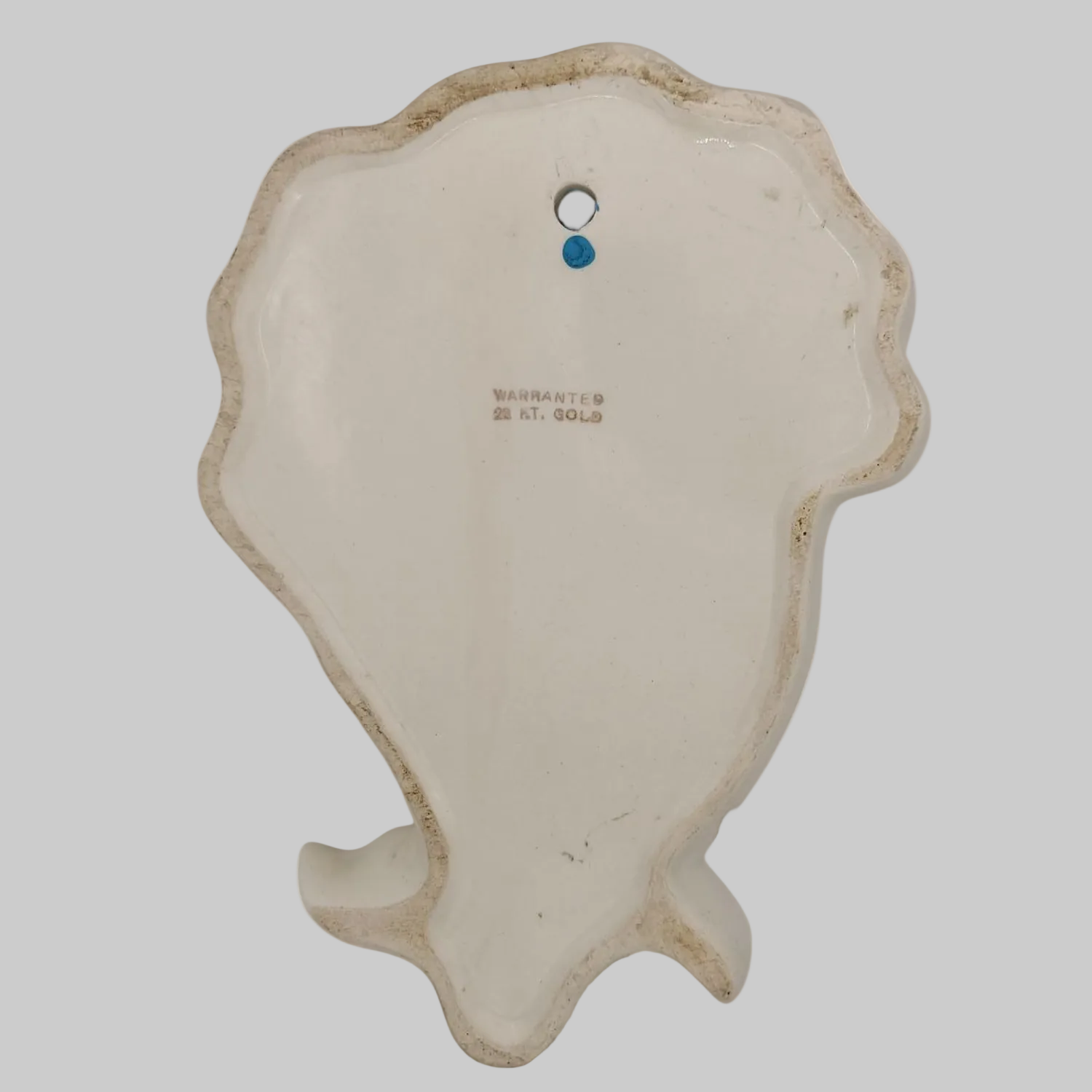 Decorative mask with a textured surface on a white background