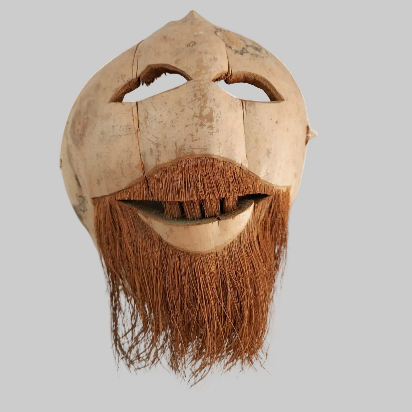 Coconut husk mask with a beard on a white background