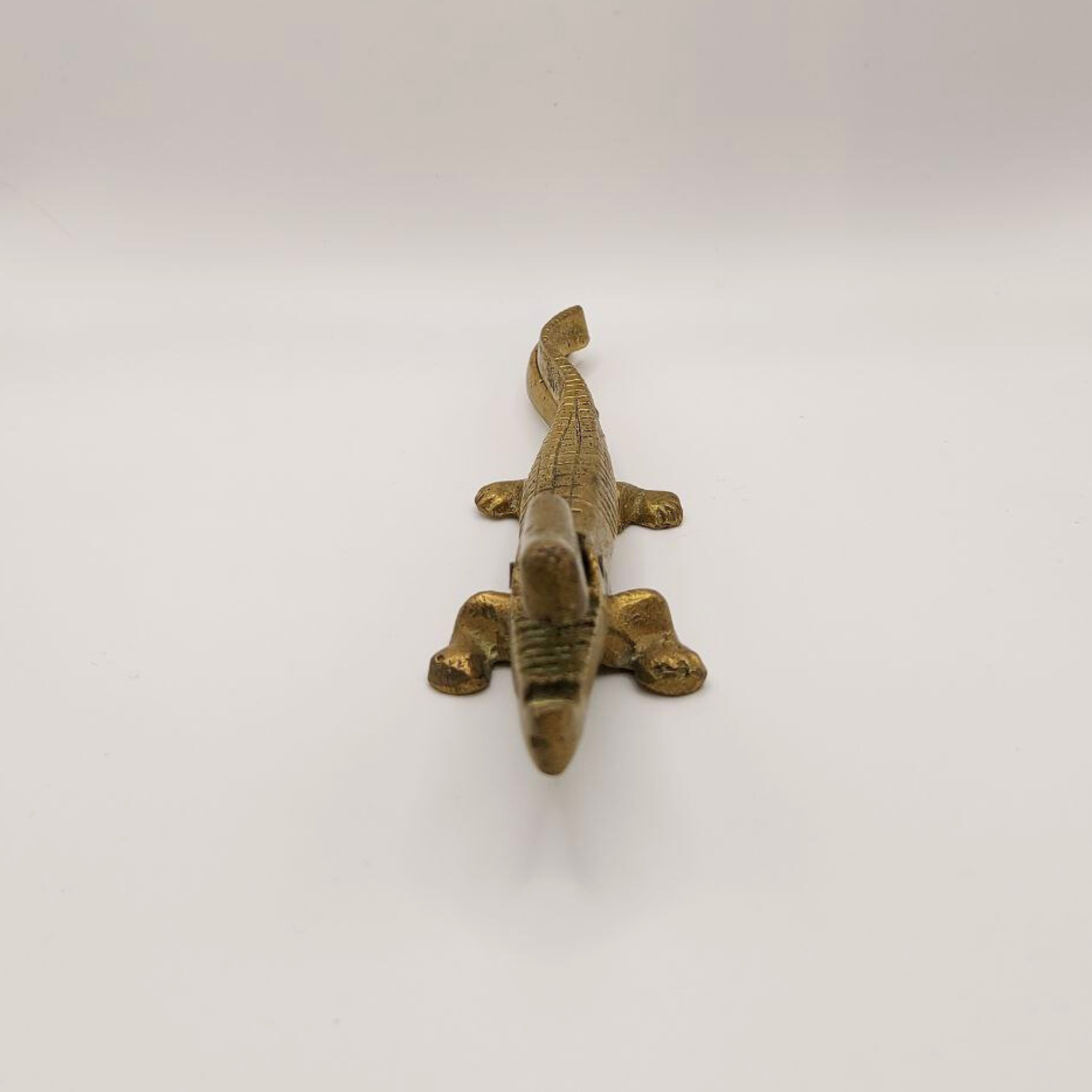 Bronze crocodile nutcracker on a white background