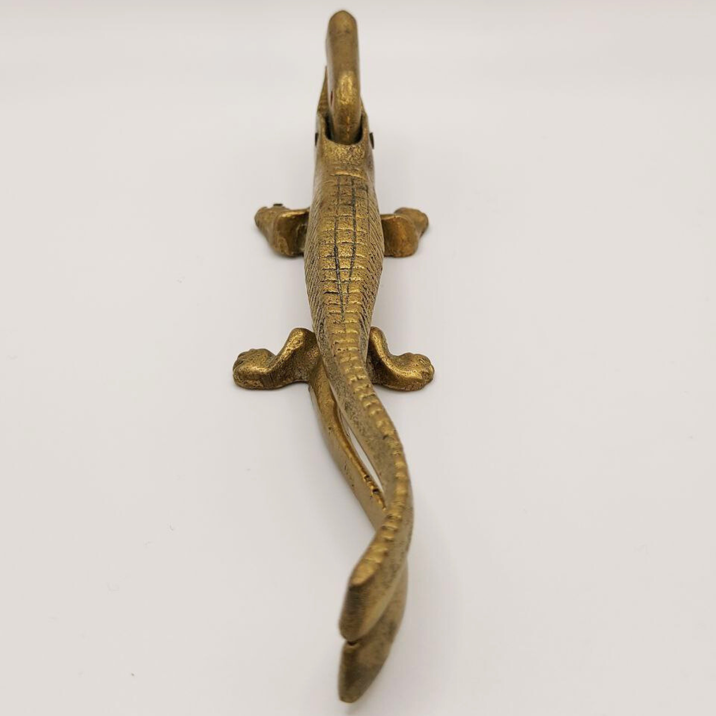 Bronze crocodile on a white background