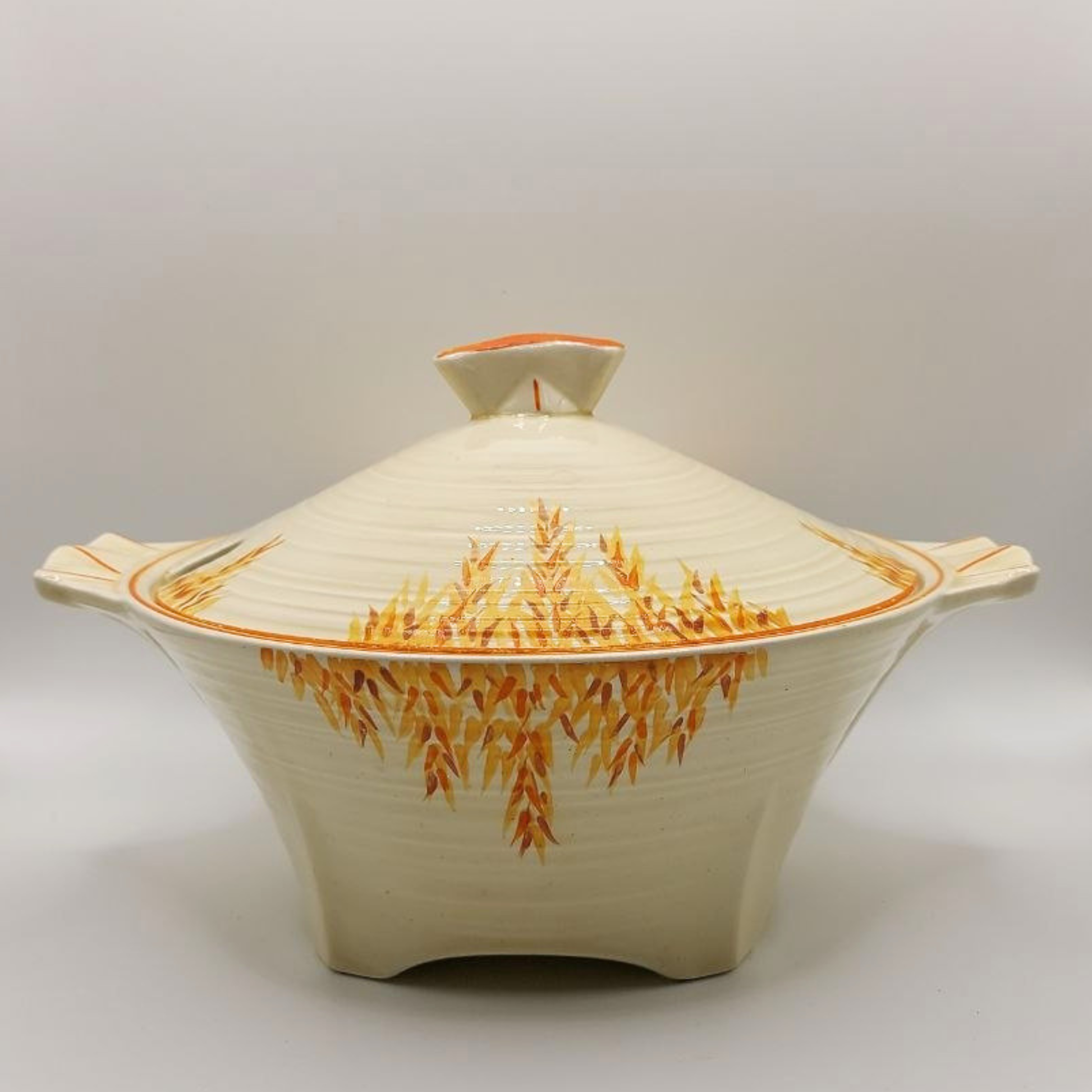 Ceramic dish with lid featuring a decorative pattern on a plain background