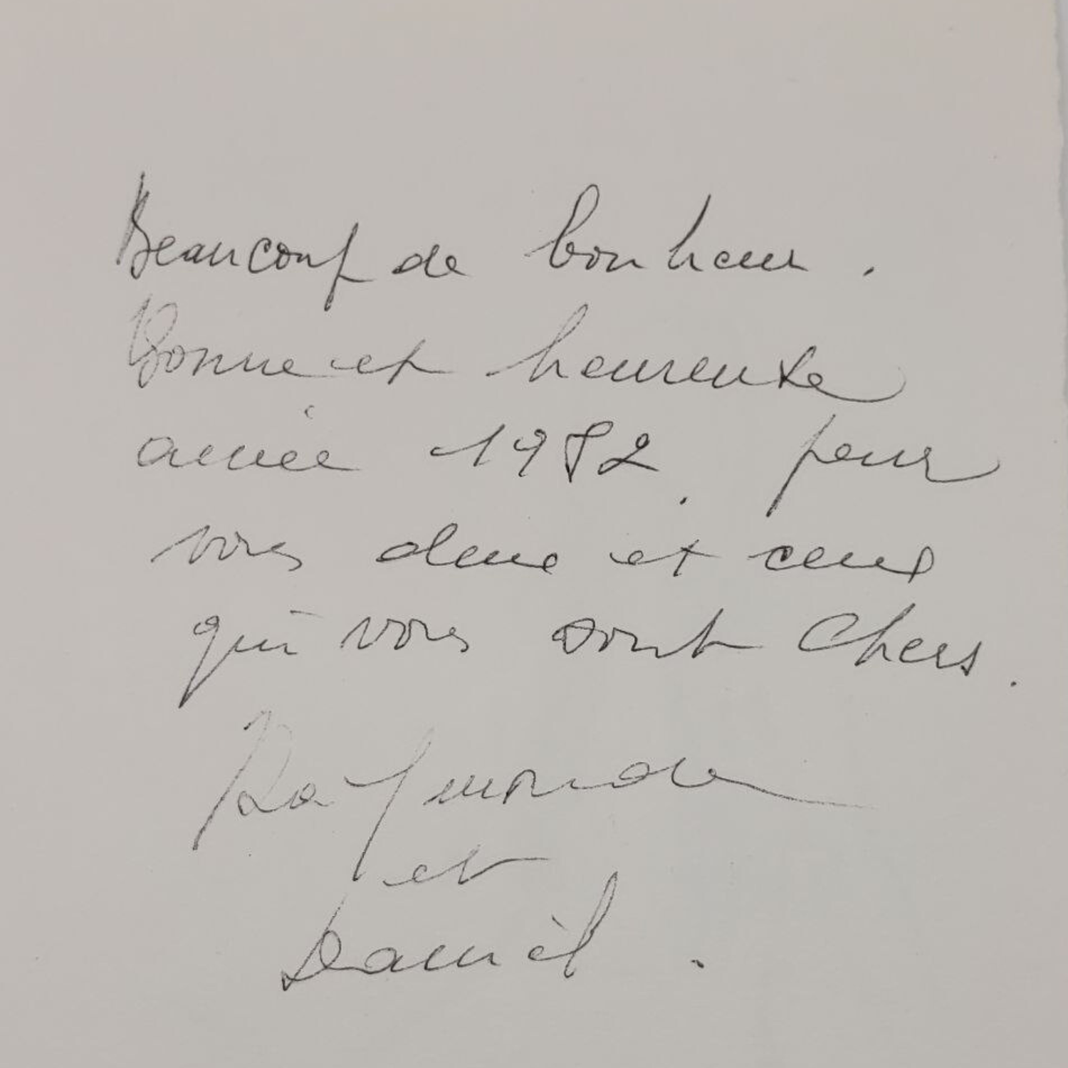 Handwritten note in French on a light background