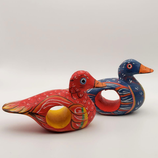 Two duck napkin holders on a white background