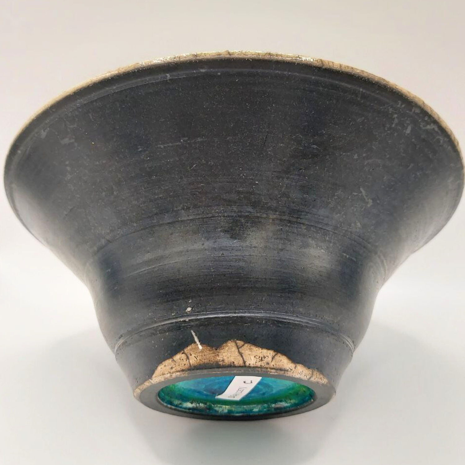 Black ceramic bowl on a white background
