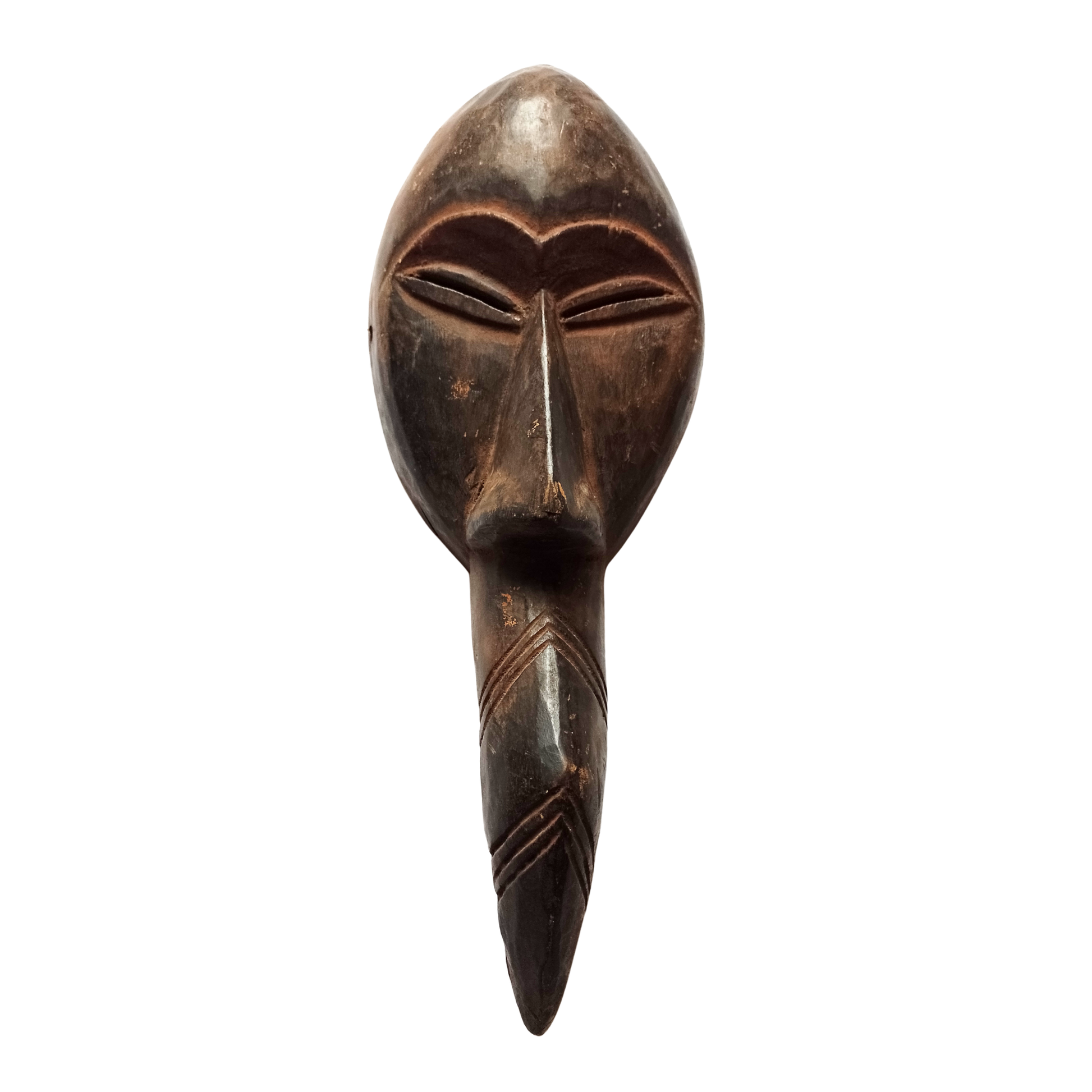 An African Fang-style mask against a white background. 