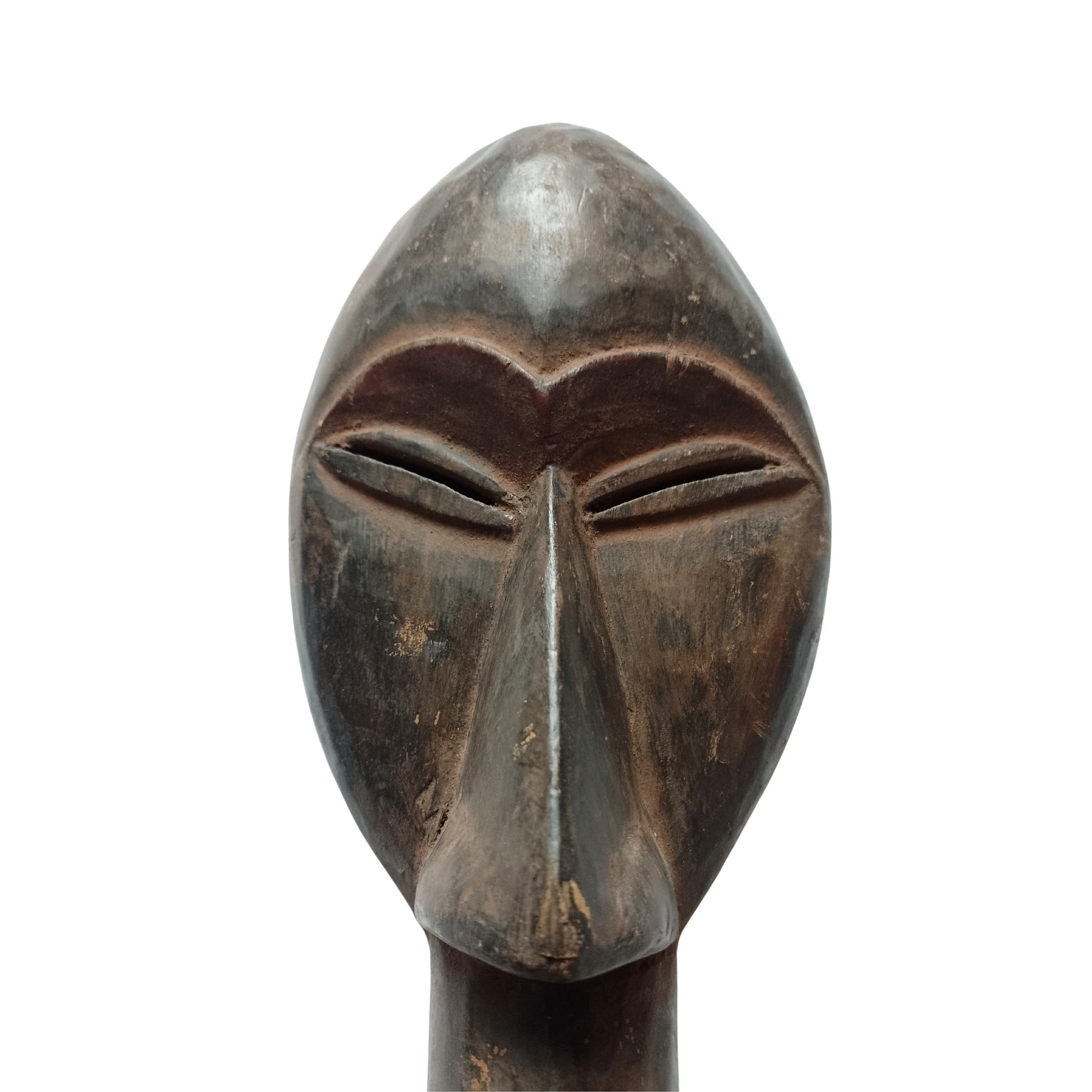 The face of an African Fang mask against a white background. 