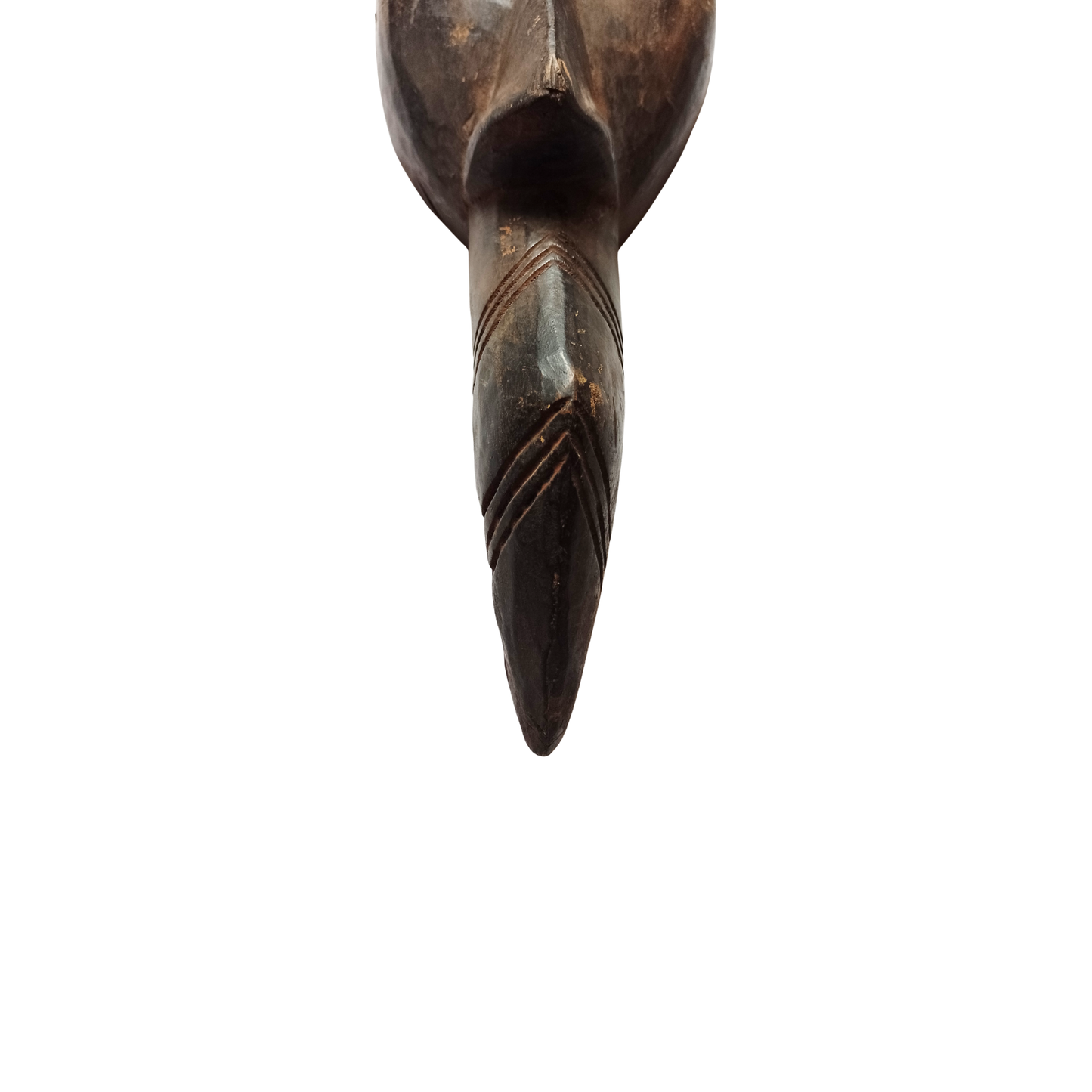 Wooden African mask with a pointed end on a white background
