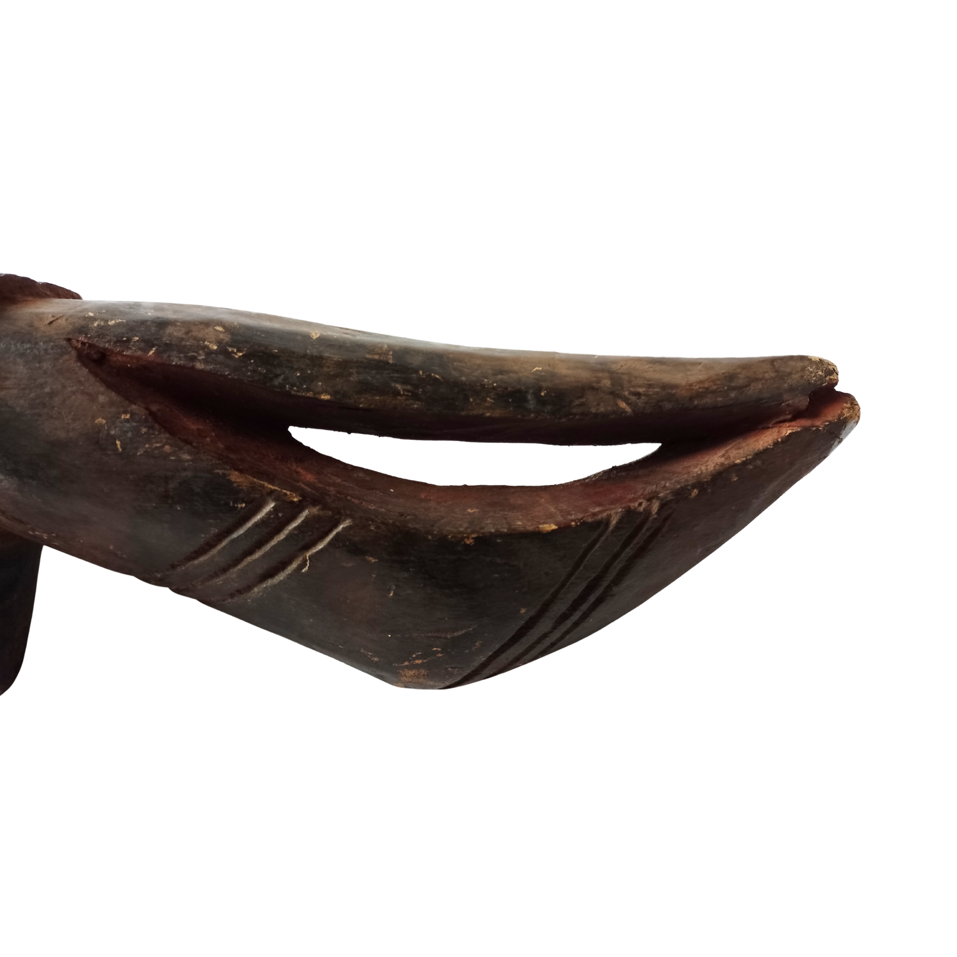 Close-up of a wooden mask with a dark brown finish on a white background