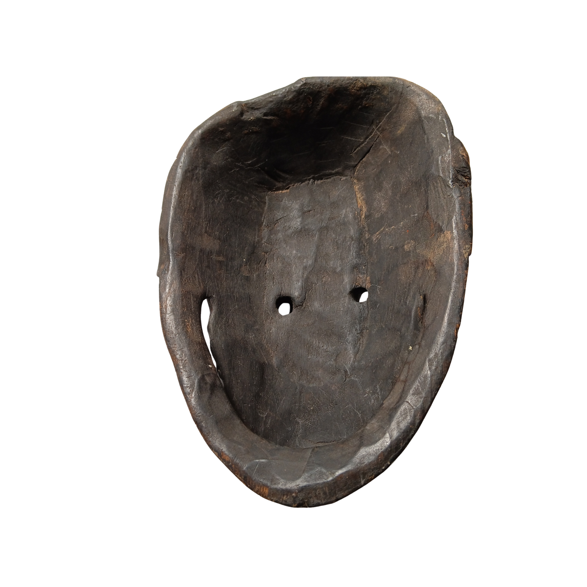 A dark carved wooden mask with two small circular cutouts, shown against a plain white background.