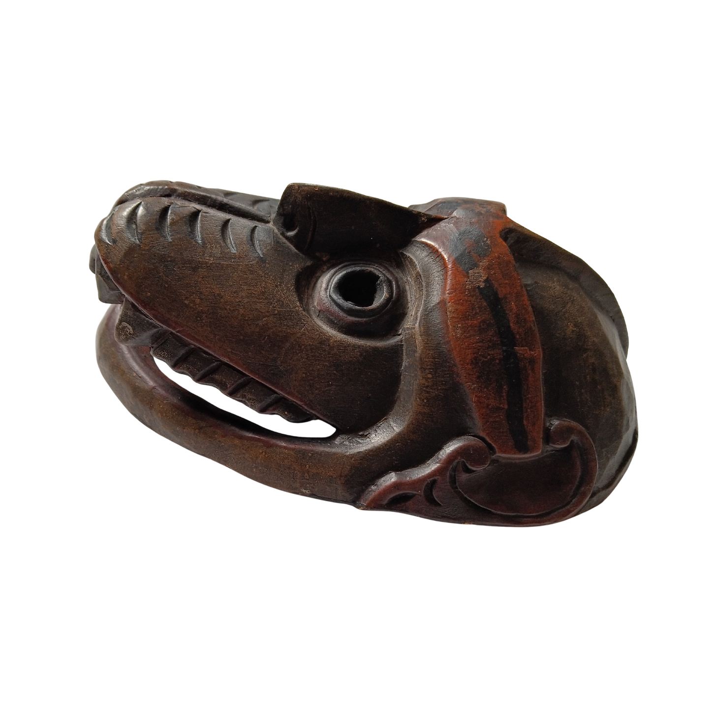 A carved dark brown mask with a textured, weathered finish, shown on a plain white background.
