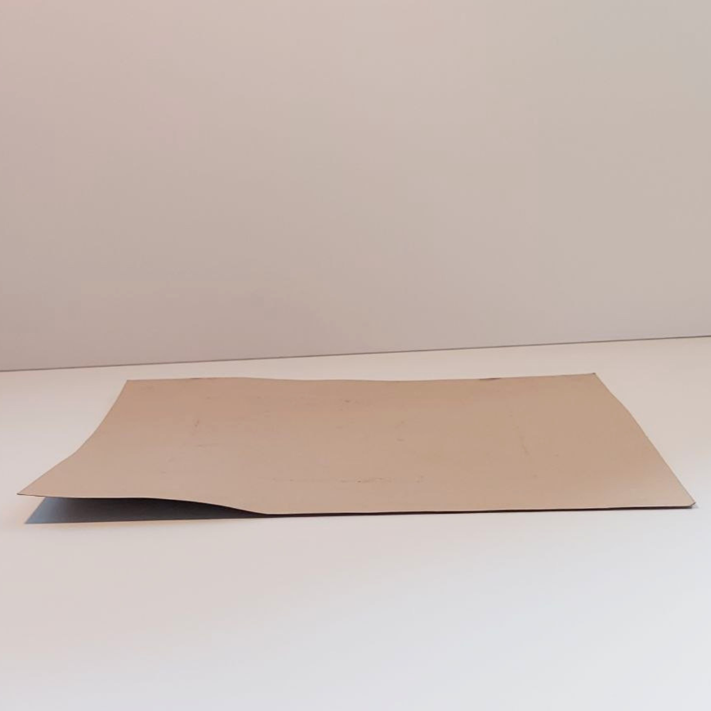 A face down piece of art card. 