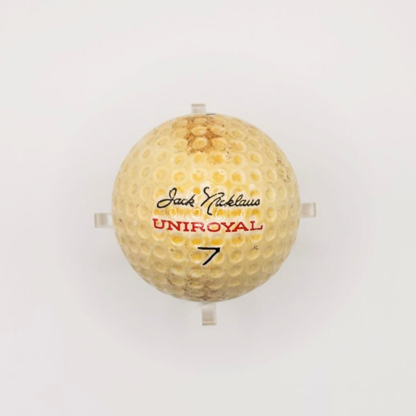A vintage Jack Nicklaus Uniroyal golf ball against a white background. 