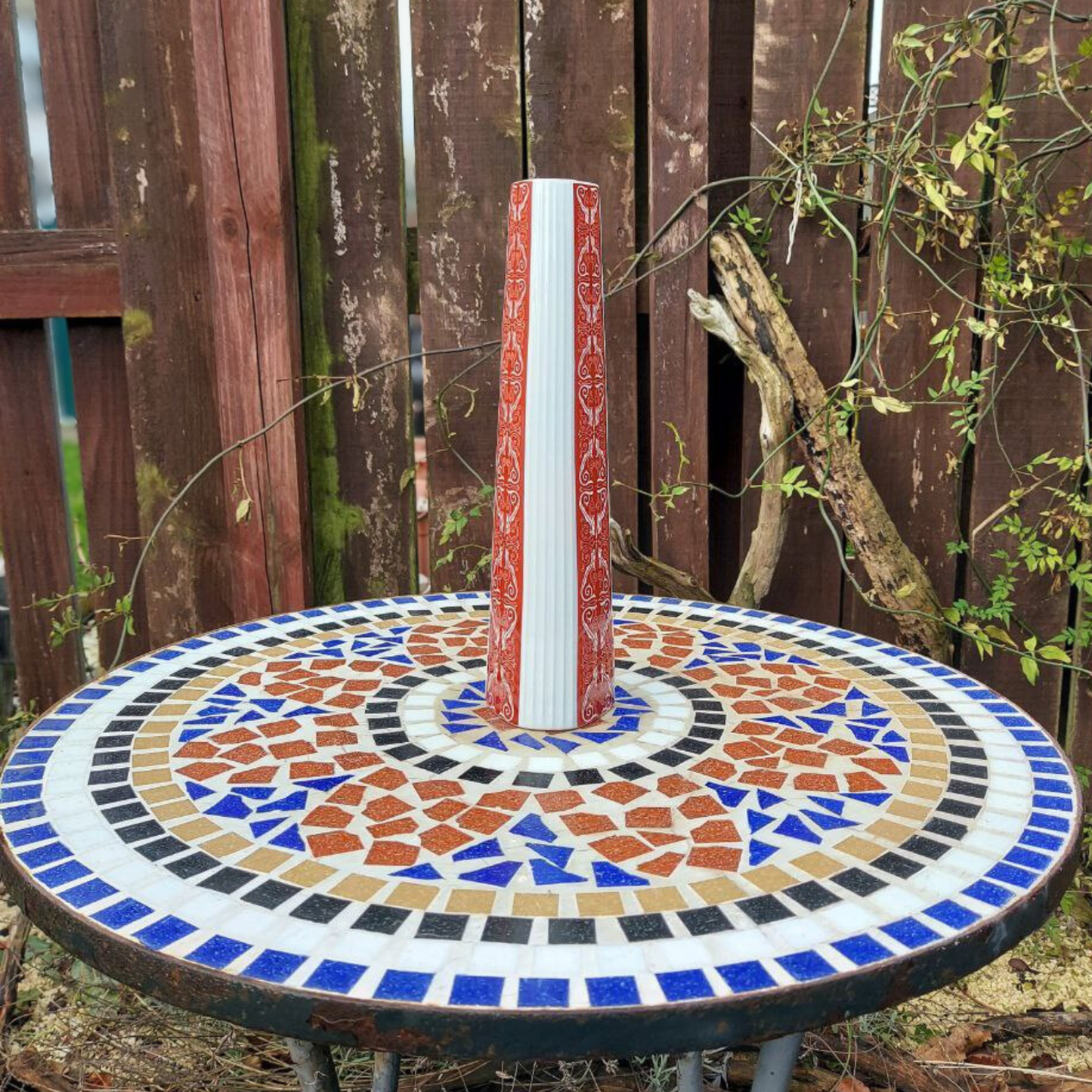 Jaeger Bavarian vase on a mosaic garden table. 