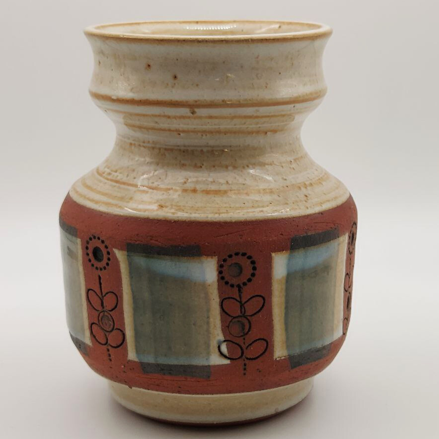 Ceramic vase with decorative patterns on a white background