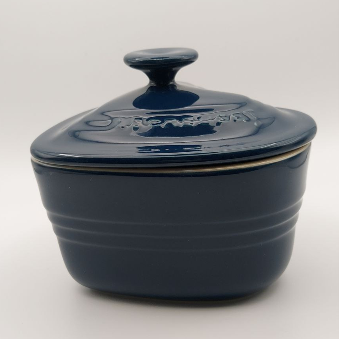 Blue ceramic dish with a lid on a white background
