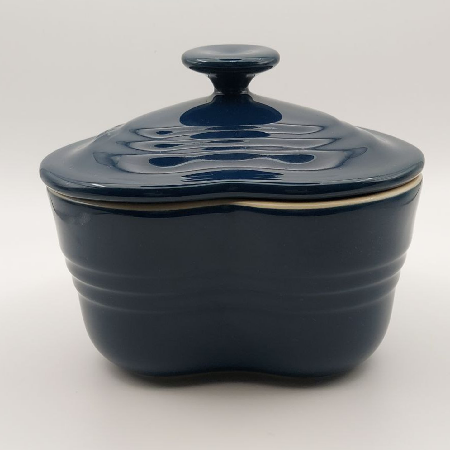 Blue ceramic lidded container on a white background