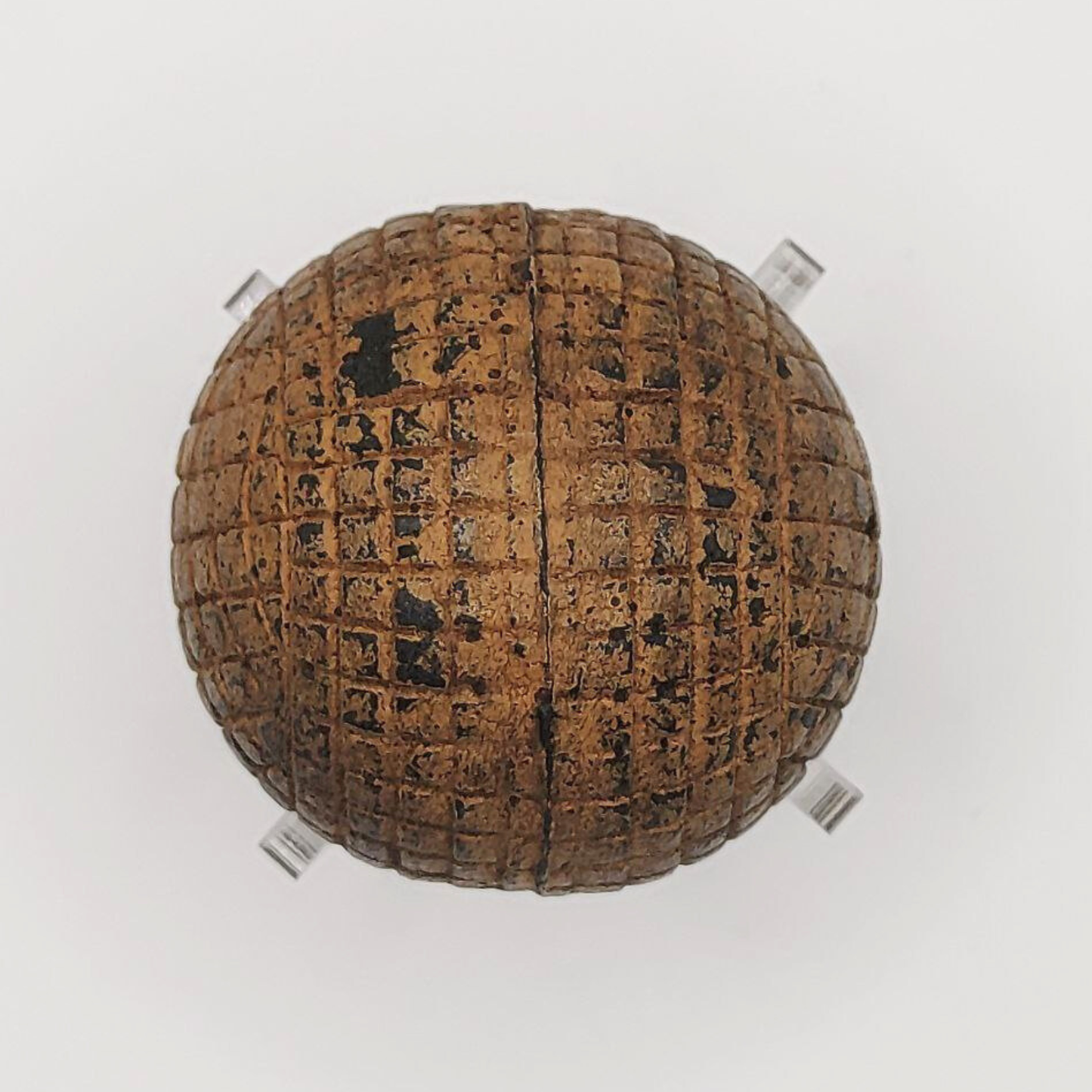 Golf ball with line-cut pattern on a white background