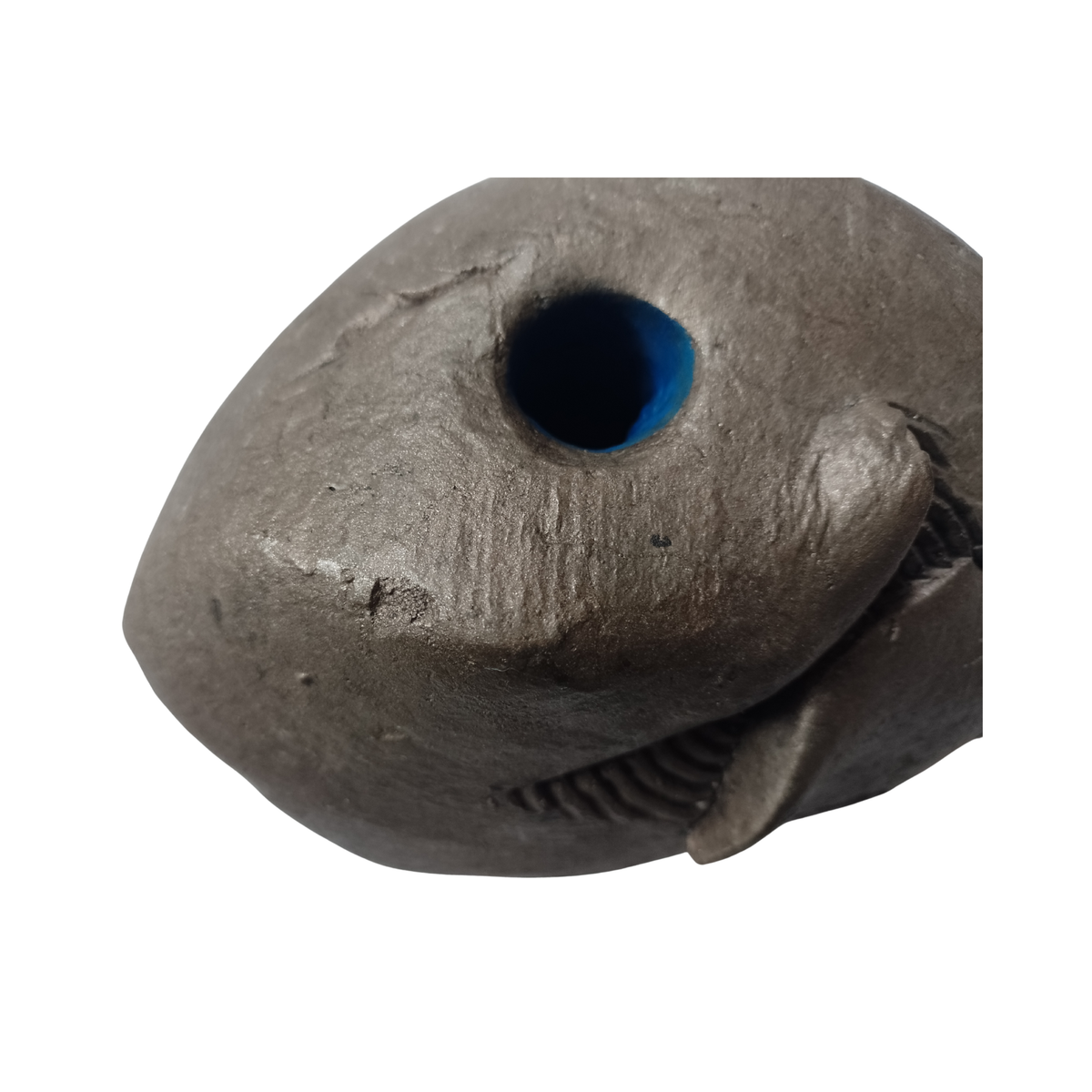 Abstract sculpture with a blue eye on a white background