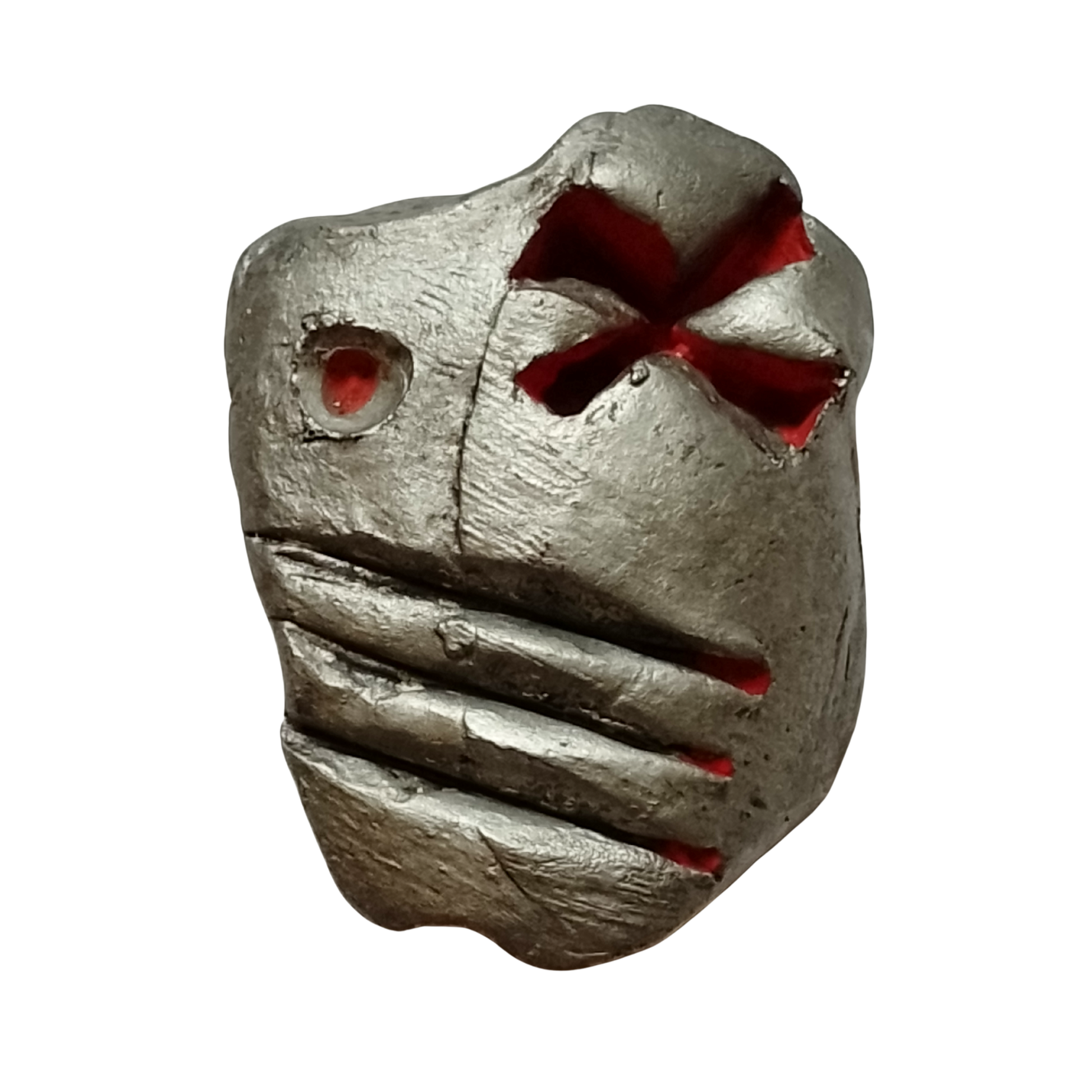 Metallic sculpture with red accents on a white background