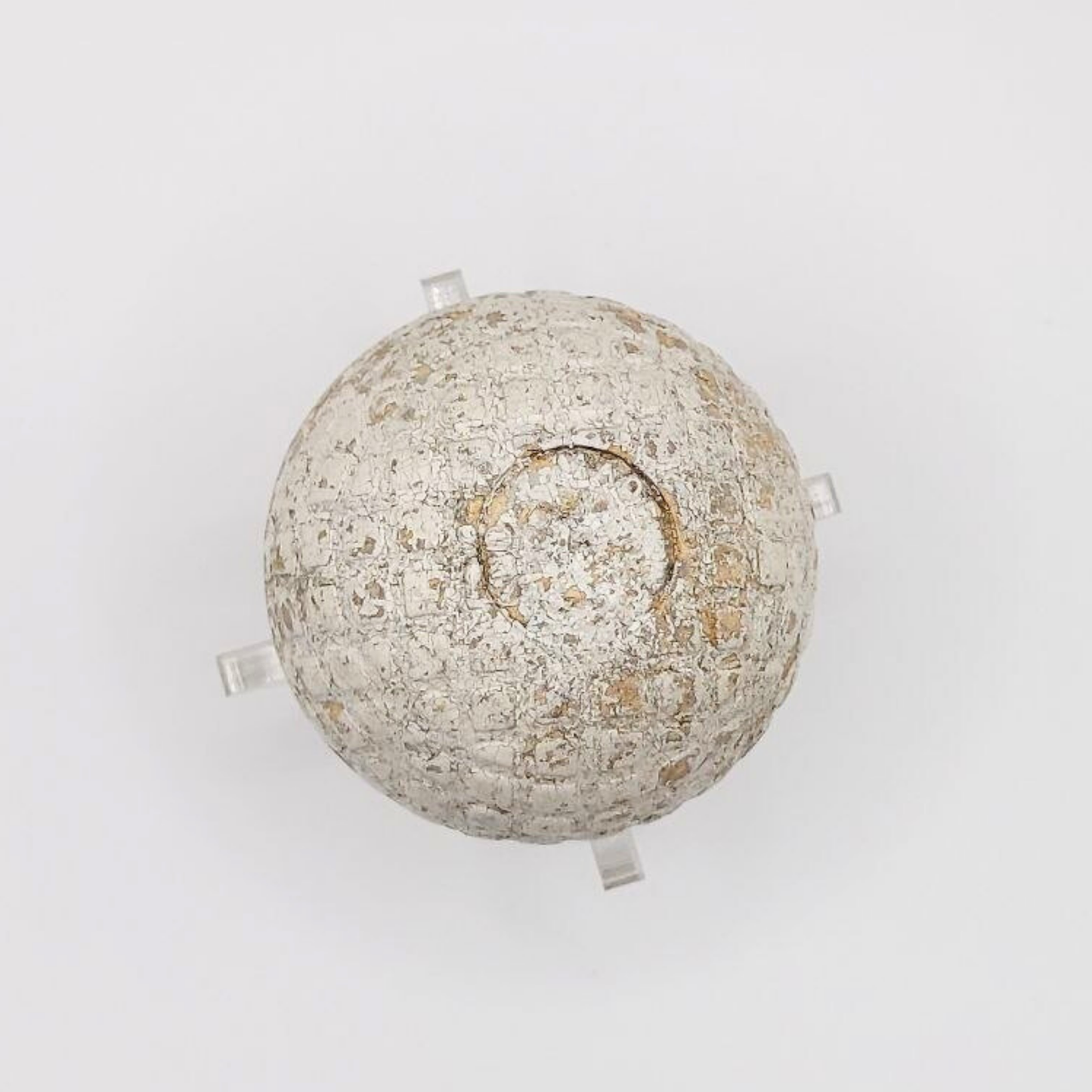 A vintage golf ball on a white background