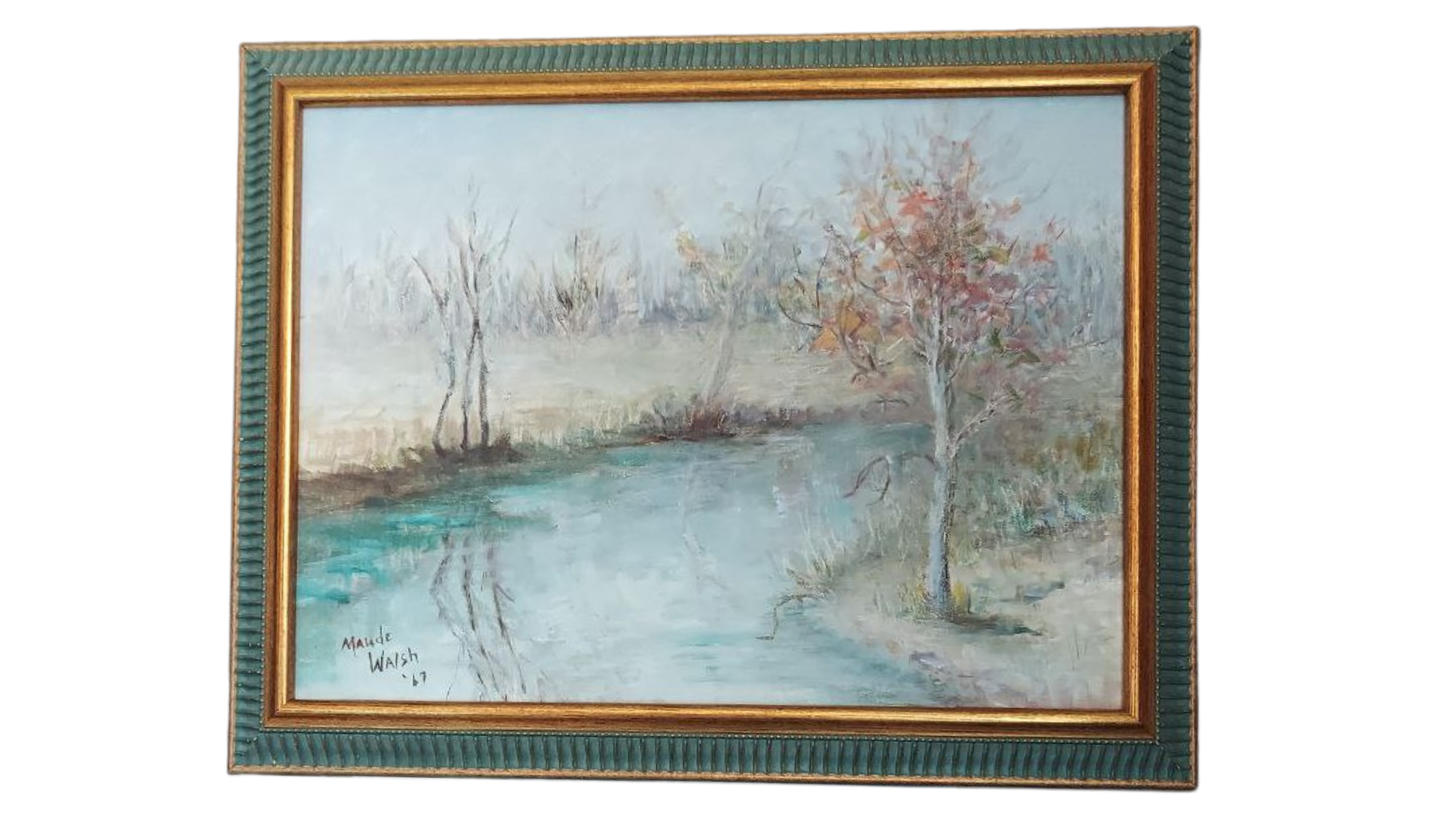Framed painting of a landscape with a tree and water