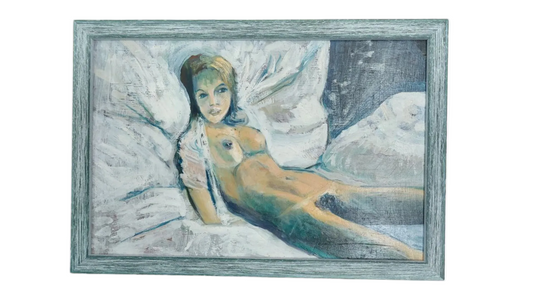 Framed artwork of a woman lying on a bed with a blue and green color scheme.