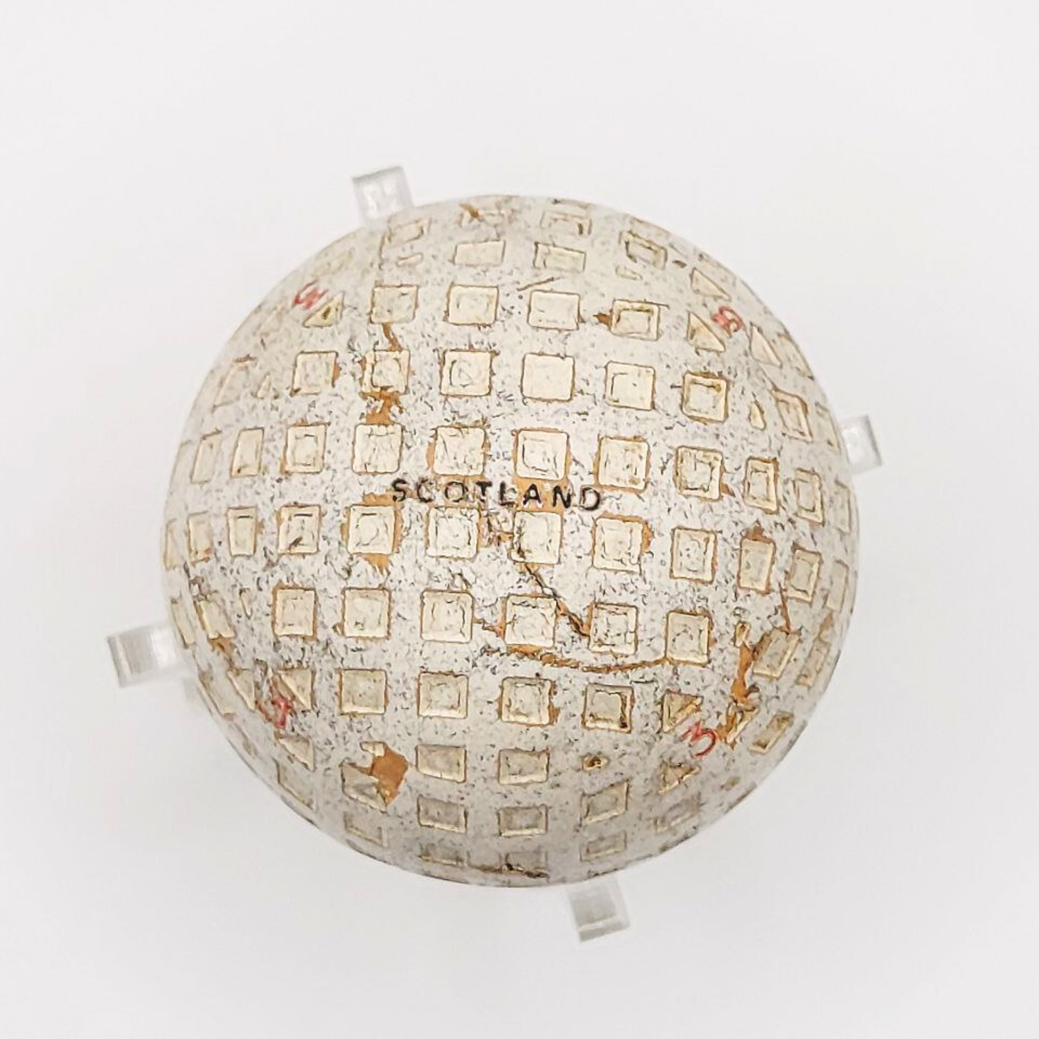 A golf ball with SCOTLAND written on it. 