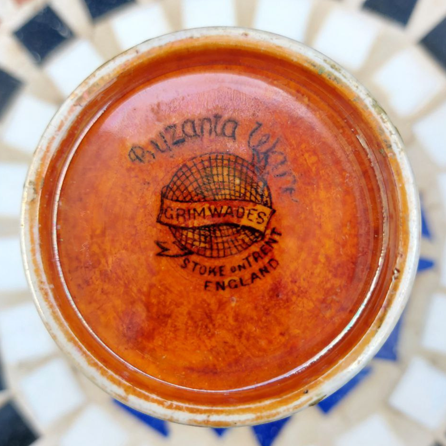 The base of a Royal Winton Byzanta Ware vase marked with "Grimwades" and "Stoke on Trent England"