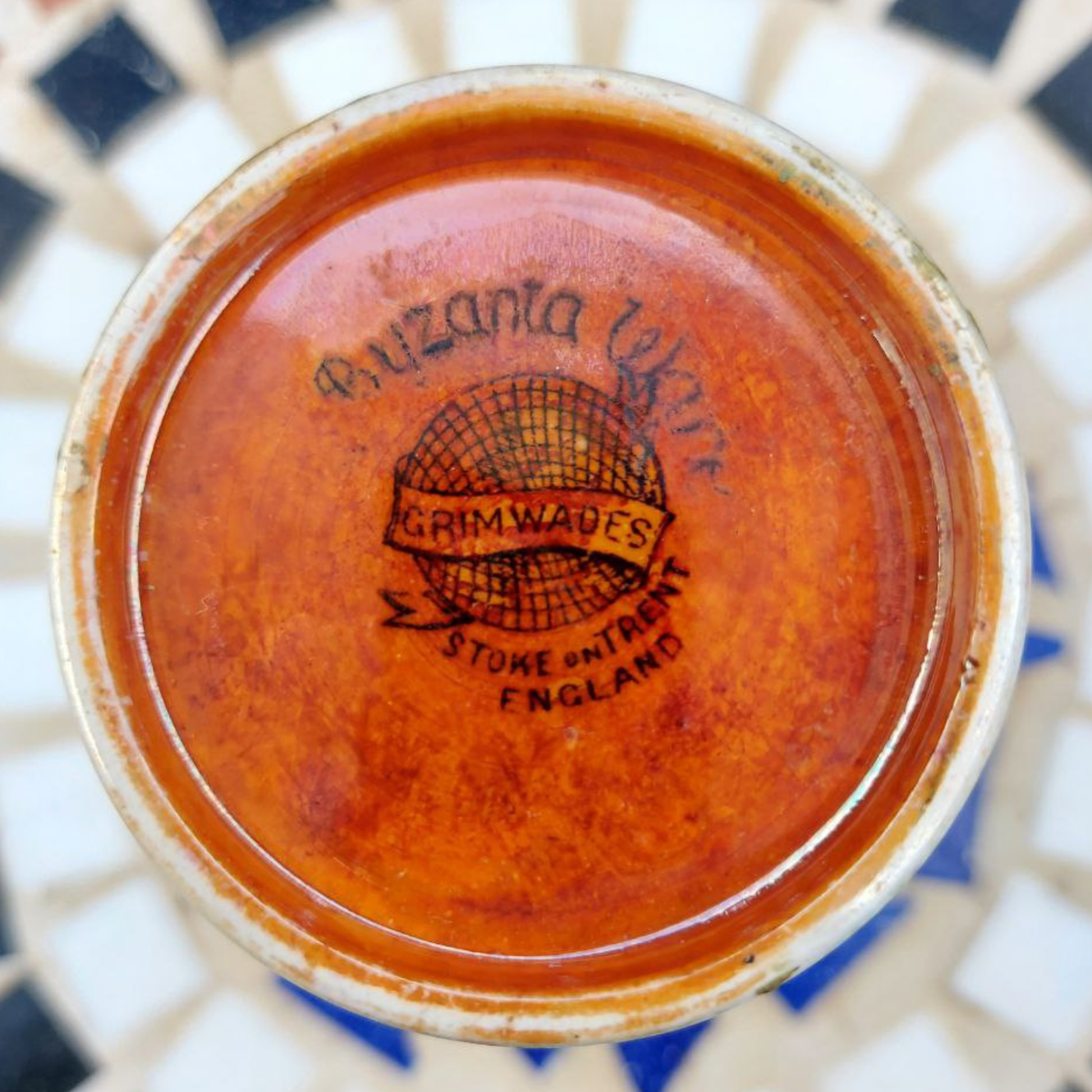 The base of a Royal Winton Byzanta Ware vase marked with "Grimwades" and "Stoke on Trent England"