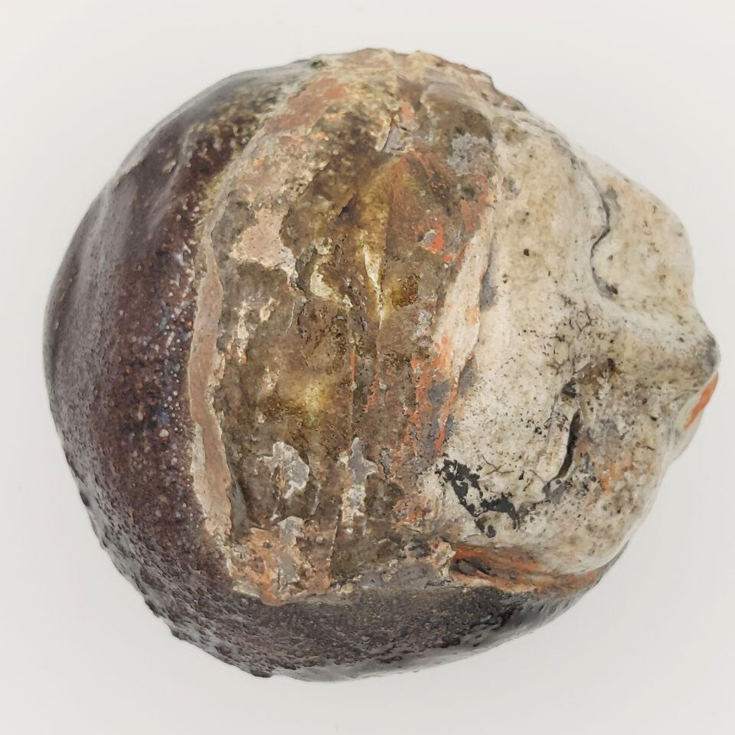 Close-up of a textured sculpture on a white background