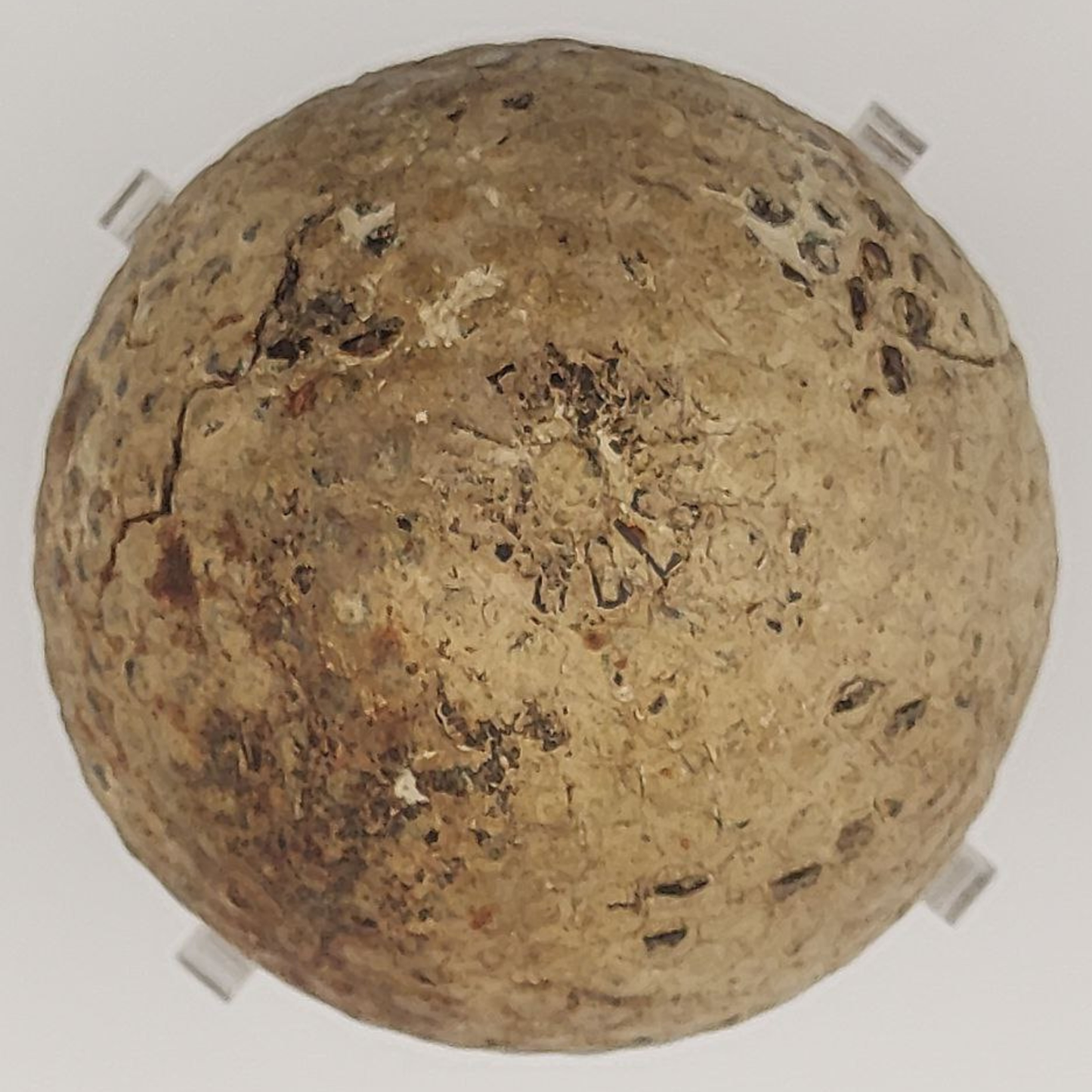 Antique St Mungo golf ball on a light background